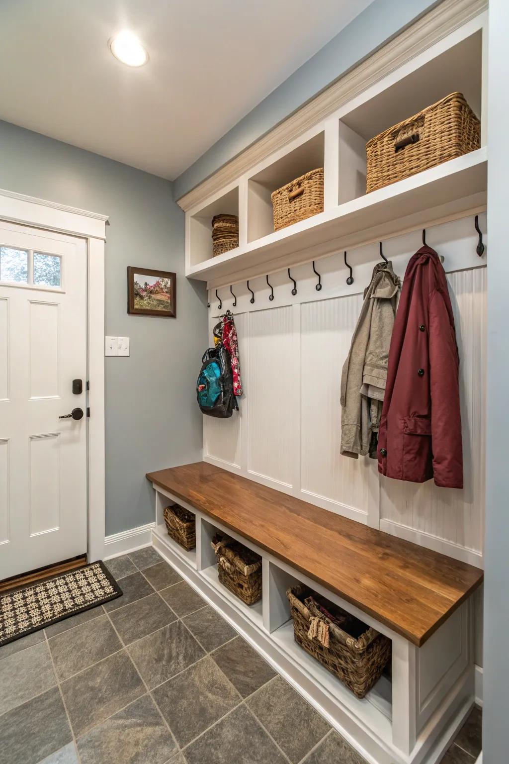 A small niche smartly transformed into a highly practical mudroom.