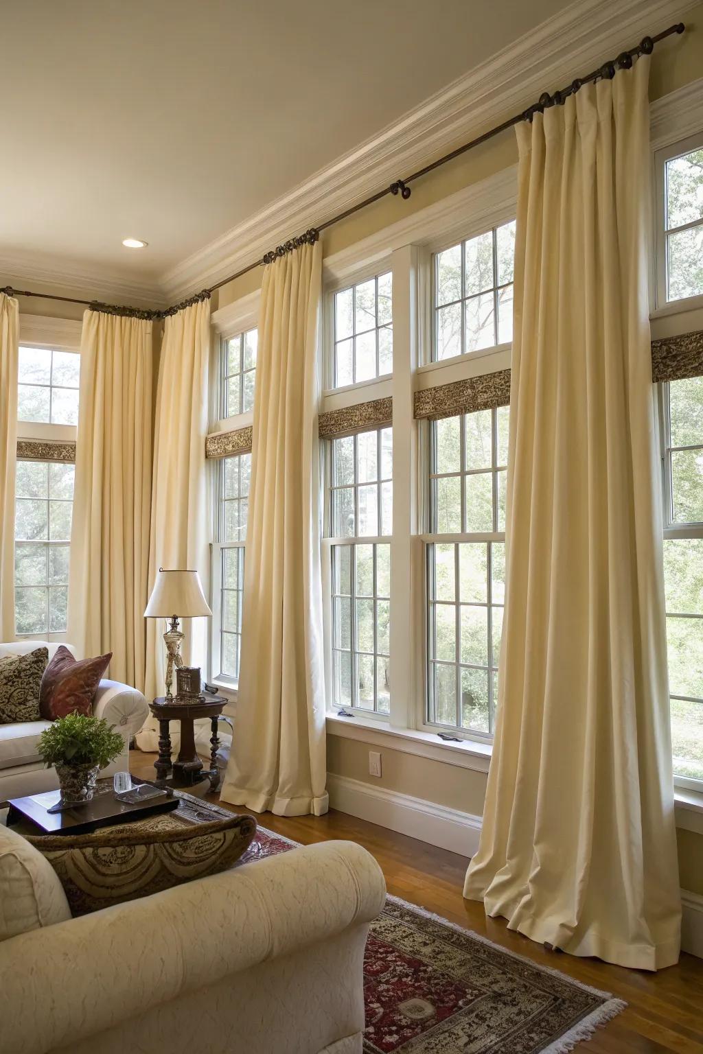 Matching drapes bring a sense of cohesion and elegance to a room graced with multiple windows.