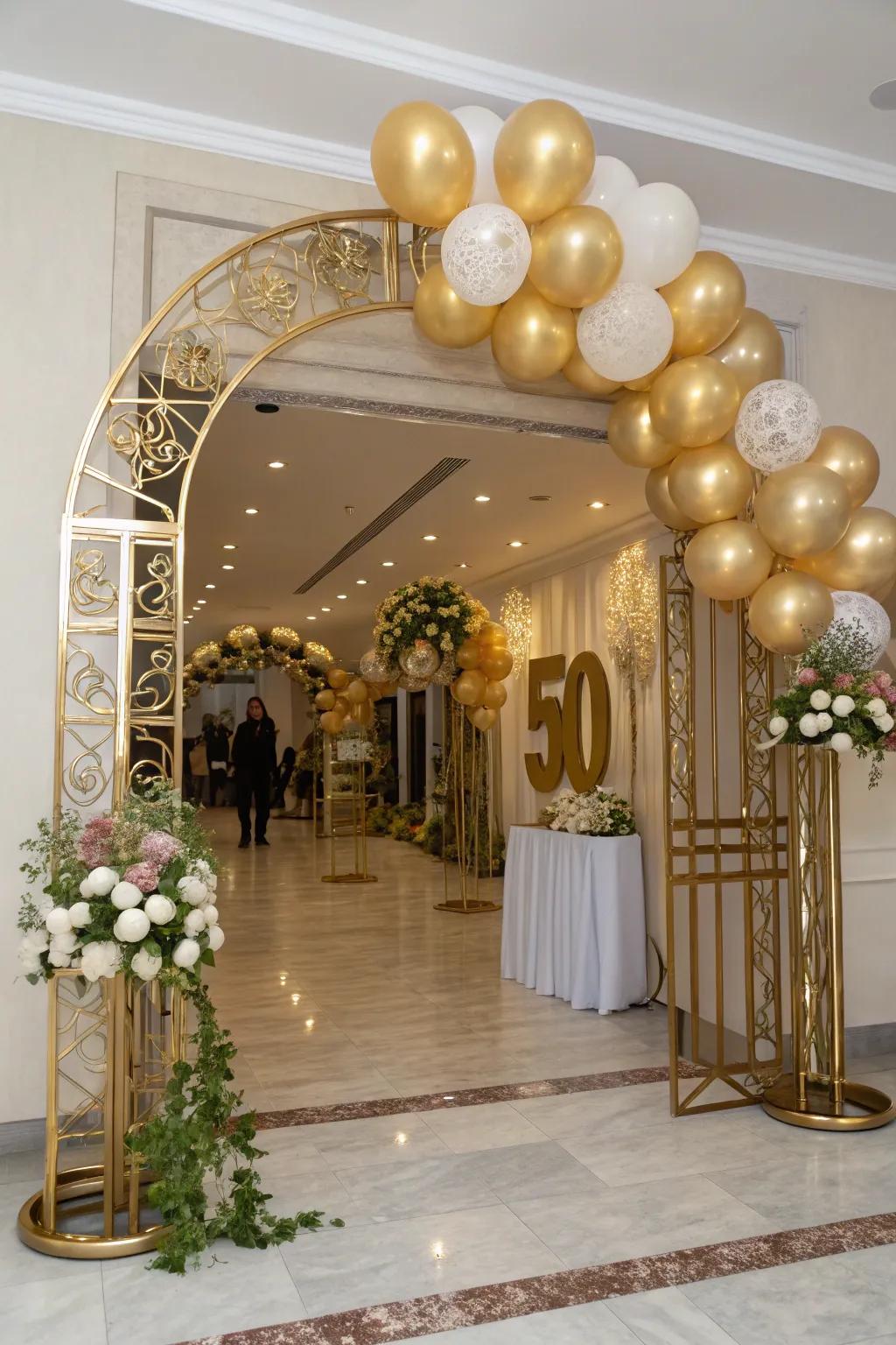 A majestic gold balloon archway is the perfect entrance for the celebration.