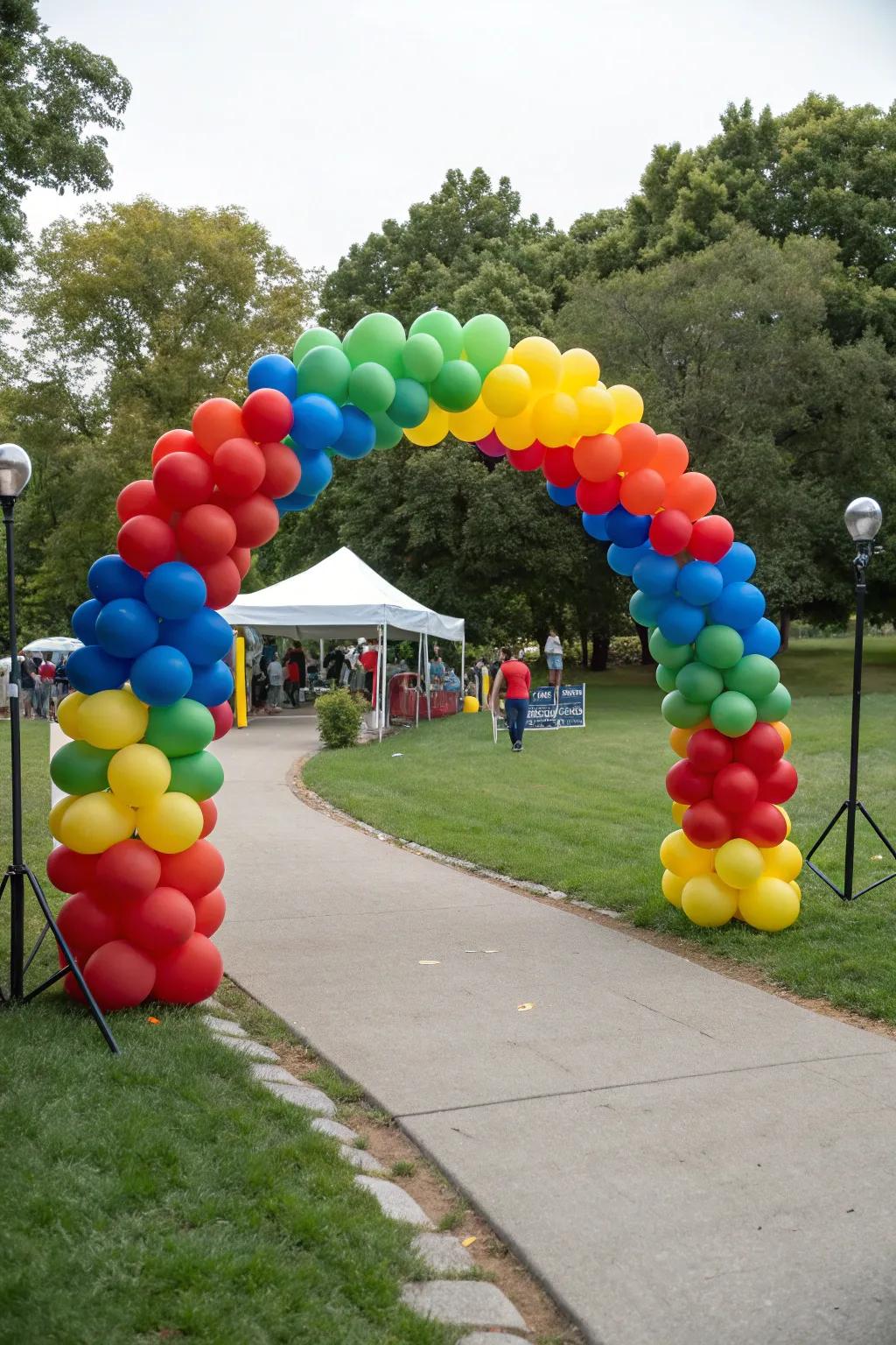 A colorful balloon arch sets the tone for a festive park gathering.