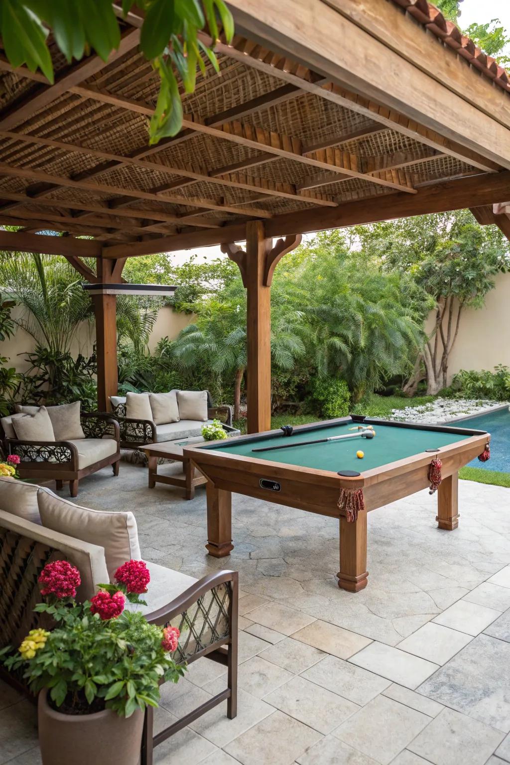 A delightful pool table arrangement nestled under a wooden trellis, furnished with seating and garden vegetation.