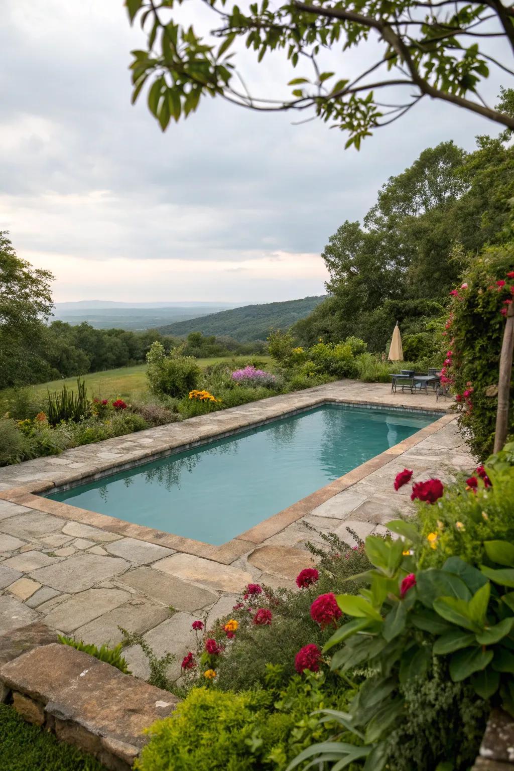 Natural stone decking wonderfully enriches the rectangular pool.