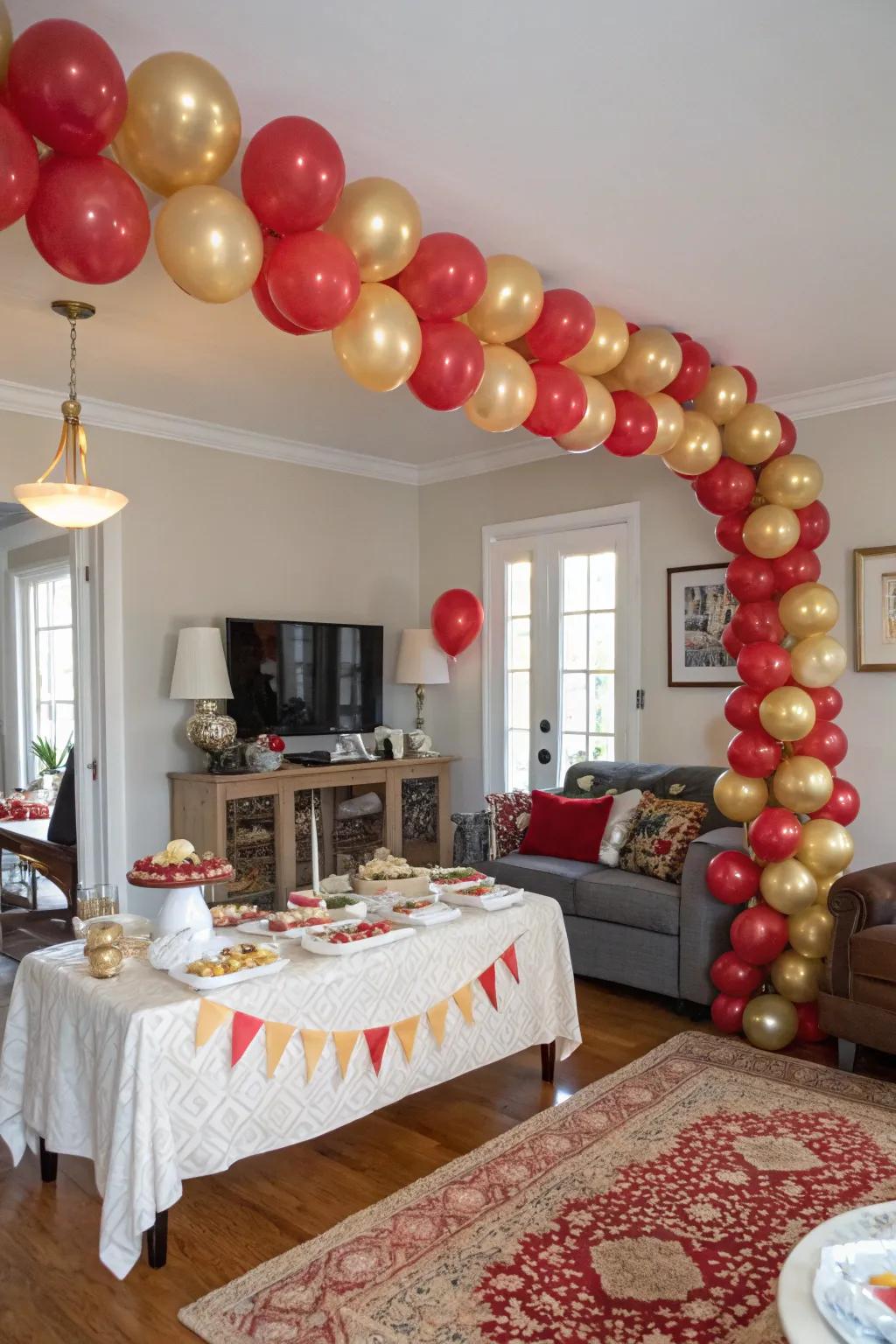 A magnificent crimson and gilded balloon arch creates a celebratory entry.