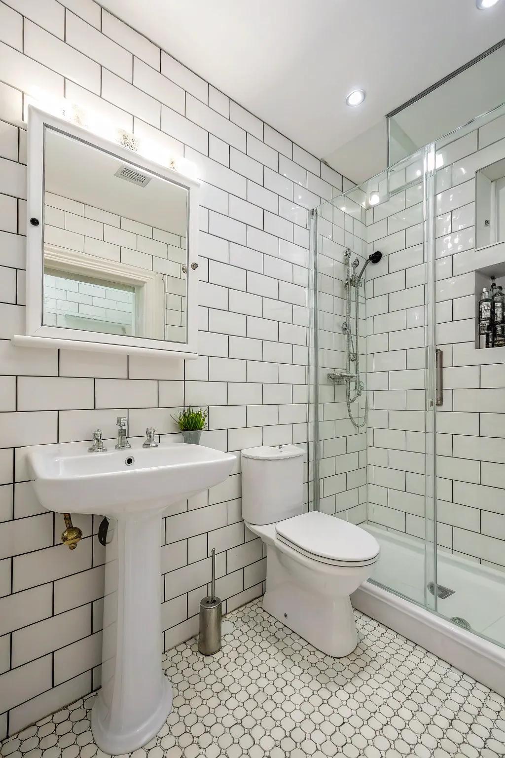 Timeless white-on-white tile design for an expansive, clean aesthetic.