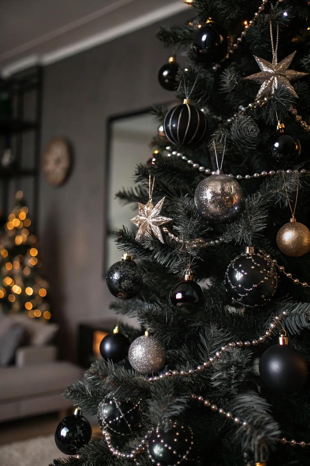 A glam rock Christmas tree enhanced with black and metallic decorations.