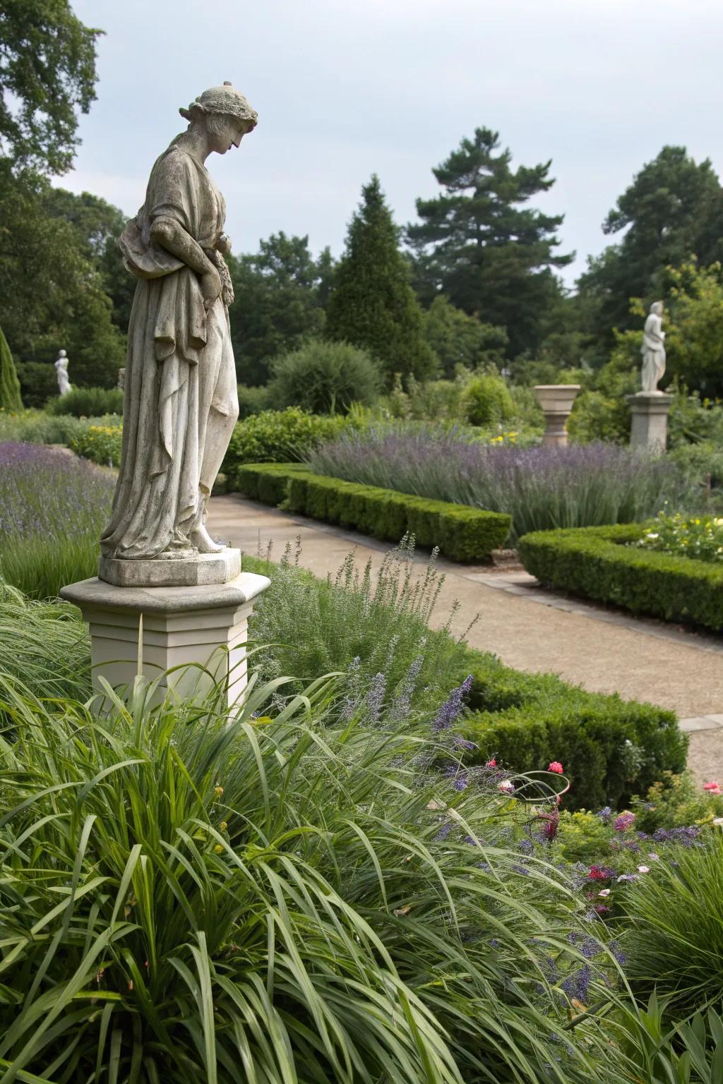 A garden figure gracefully emphasized by the lush ribbon grass surrounding it.