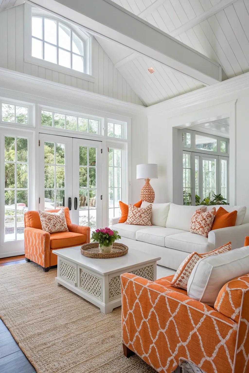 A white and orange color scheme offers a crisp feel to this living area.