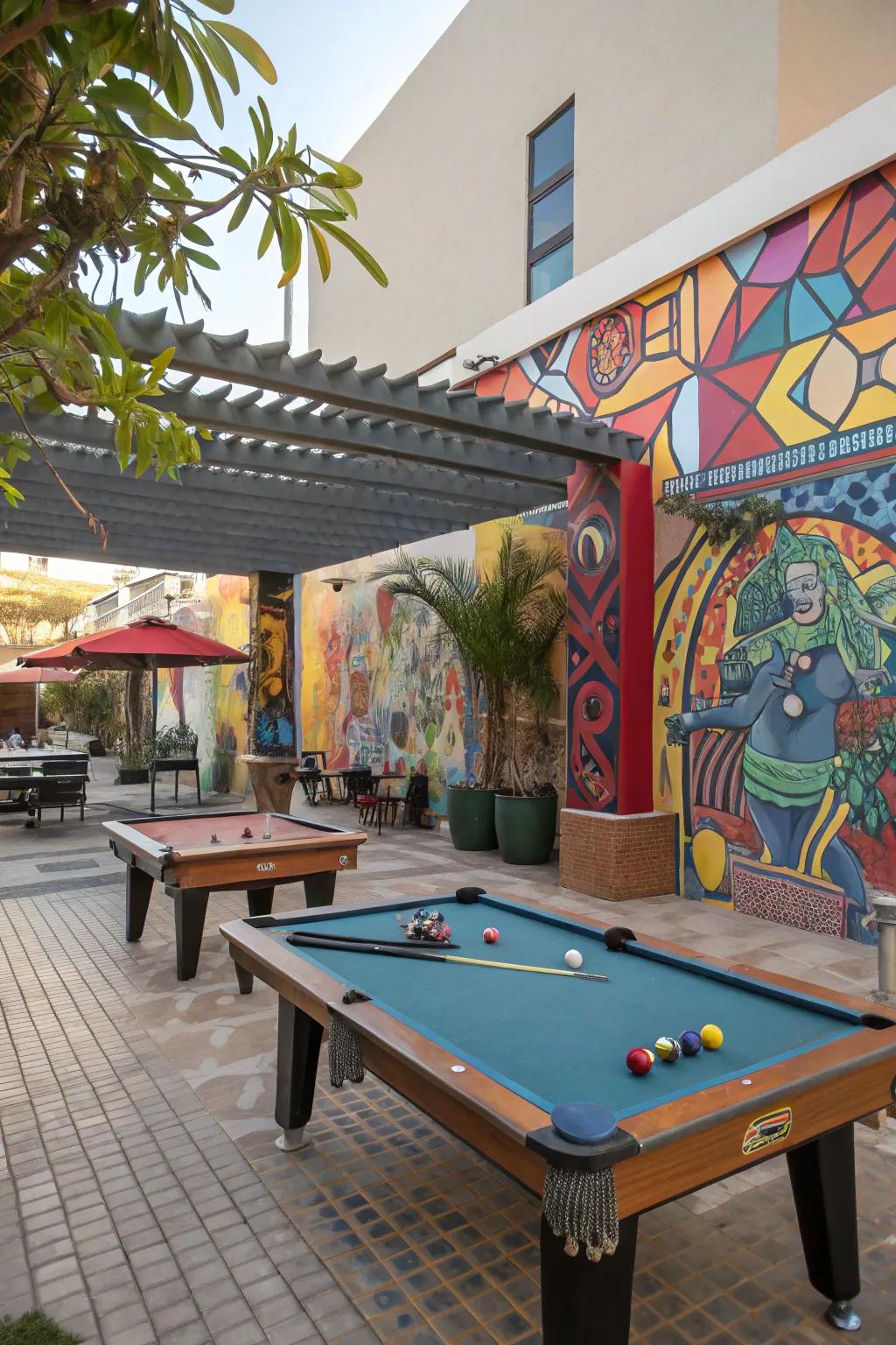 An artistic outdoor billiard table area showcasing paintings and statues.