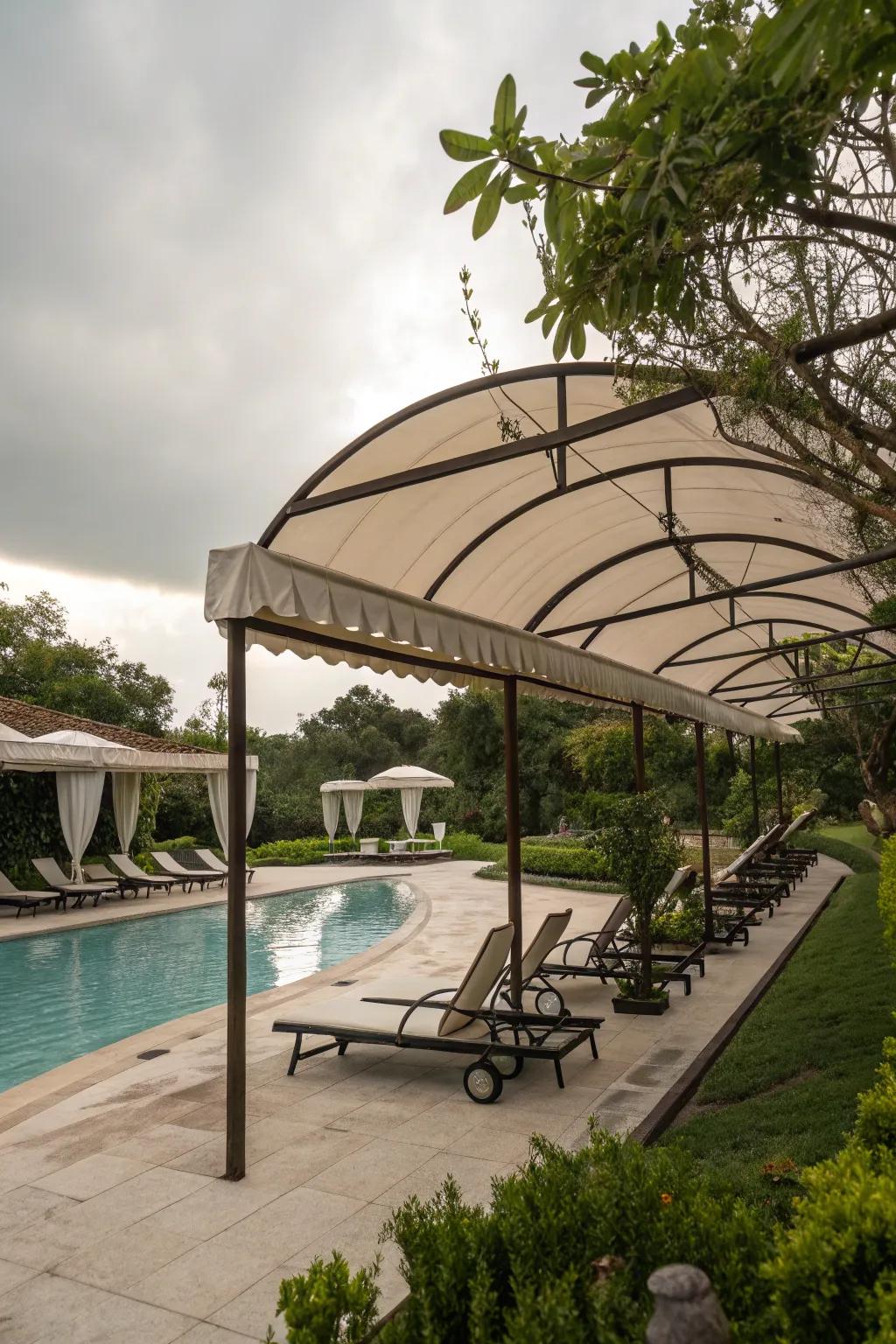 Soft curves in shade structures adding harmony and flow to poolside settings.