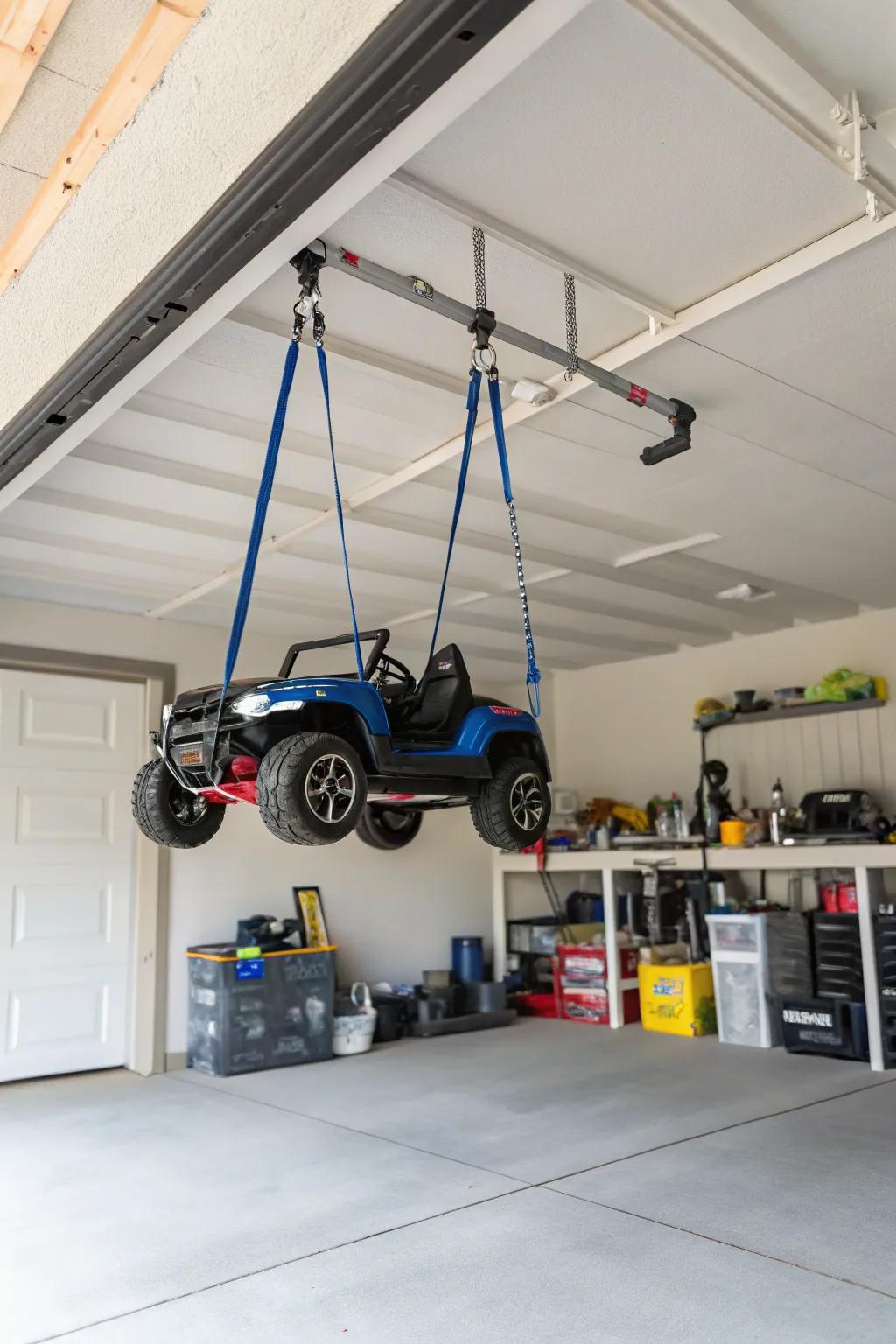 Hanging straps suspending motorized toys to clear floor space.
