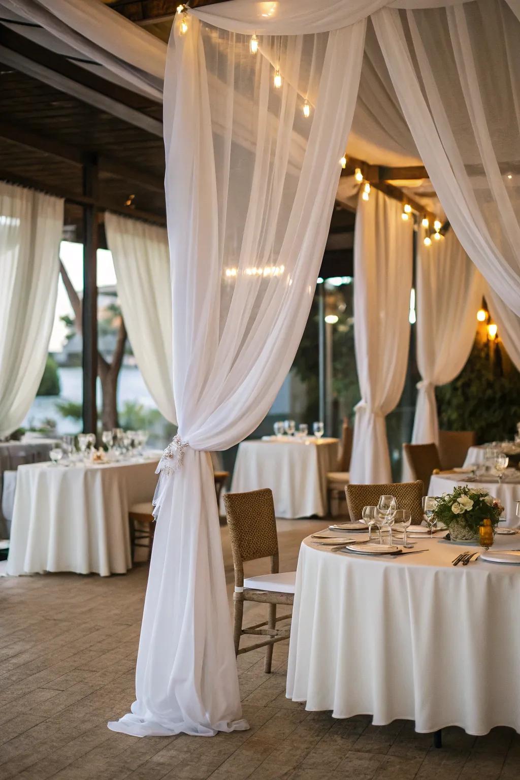 Ivory fabric tapestries add elegance and drama to the dinner setting.