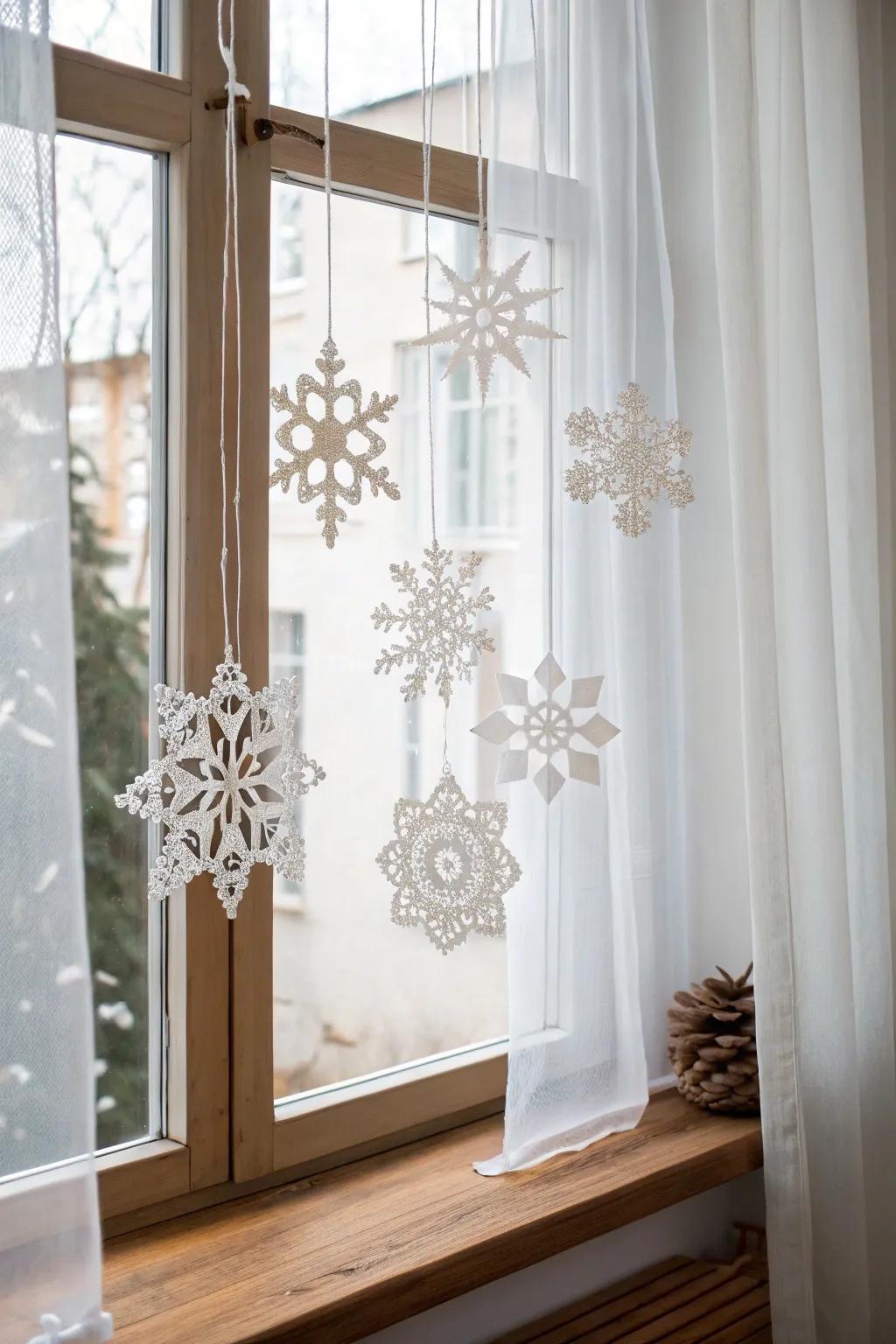Appreciate the magic of winter using a crafted snowflake mobile that dances with light.