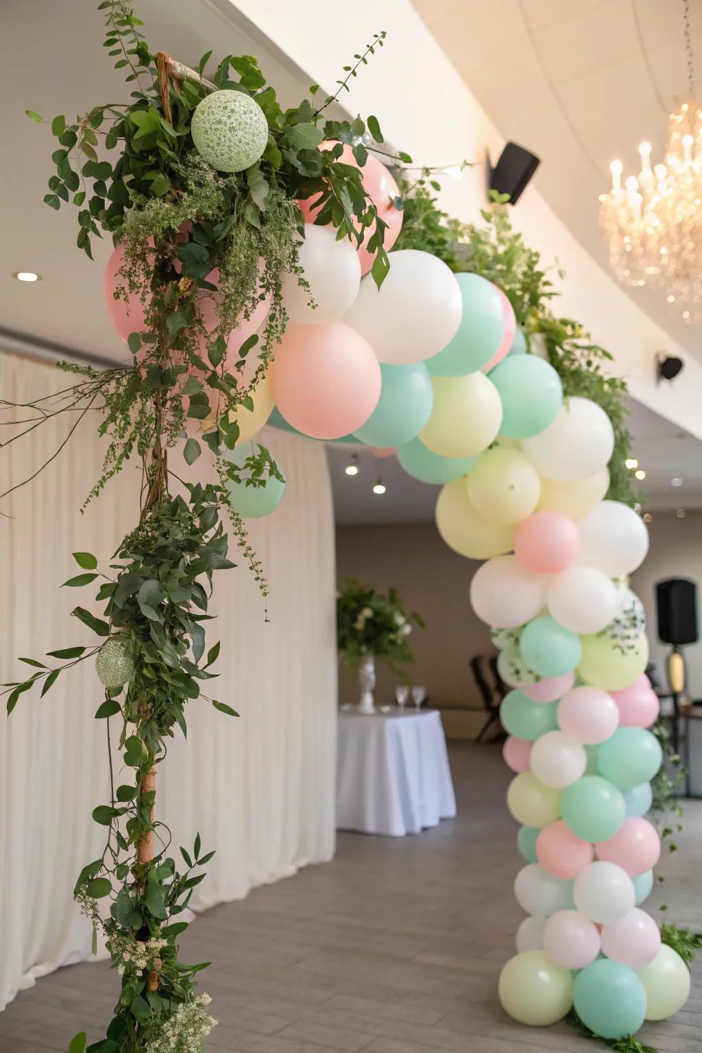 Balloon garlands intermixed with greenery craft a lush and festive visual.