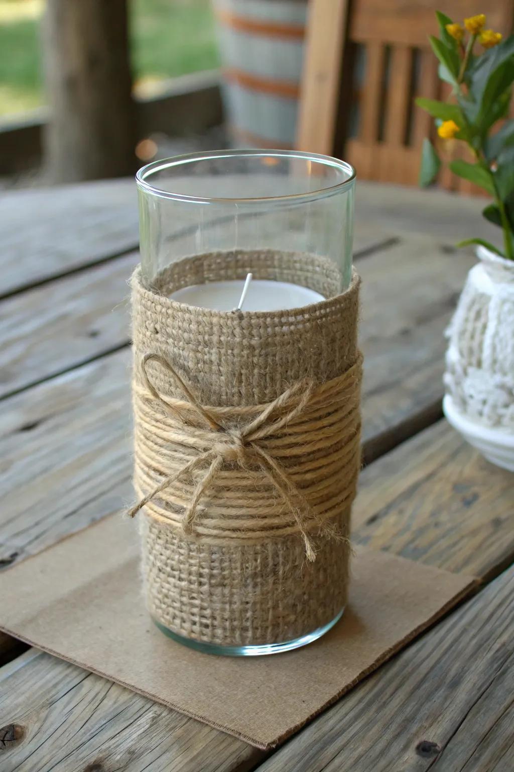 Strands of twine and coarse fabric looped around a wind-resistant holder to elicit a sense of homespun allure.