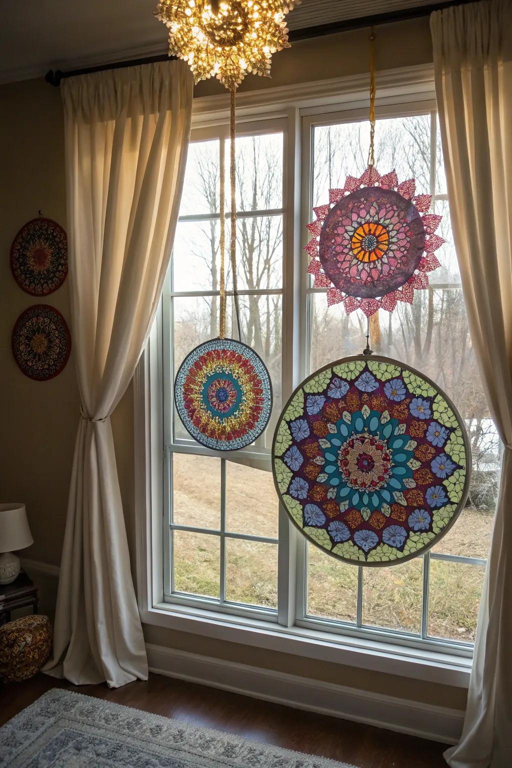 Circle motif sunlight catchers casting colorful patterns from a window.