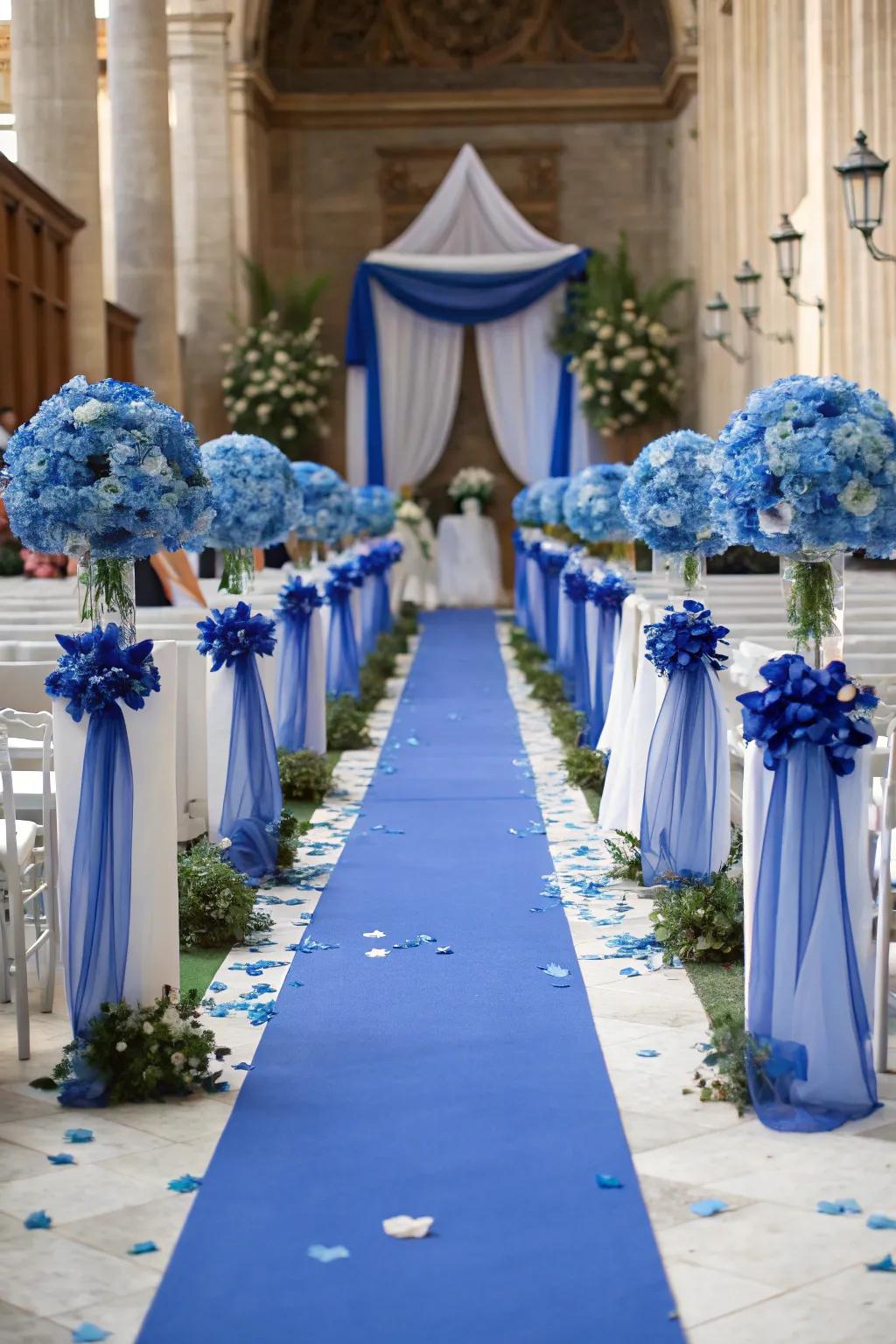 A beautifully decorated ceremony walkway with majestic blue accents.