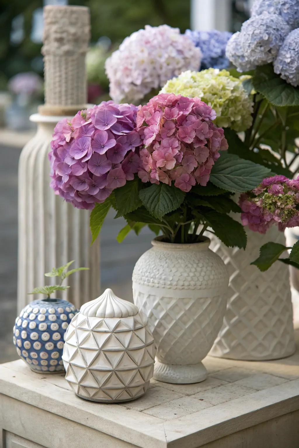 Artistic composition of hydrangeas with sculpted elements.