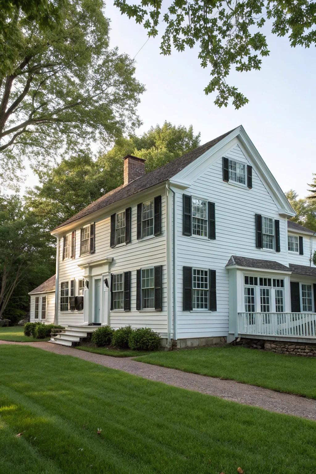Colonial home featuring vertical paneling.