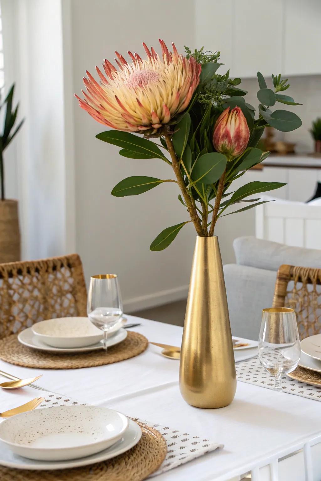 Minimalist sophistication through a solitary gilded vessel and bloom.