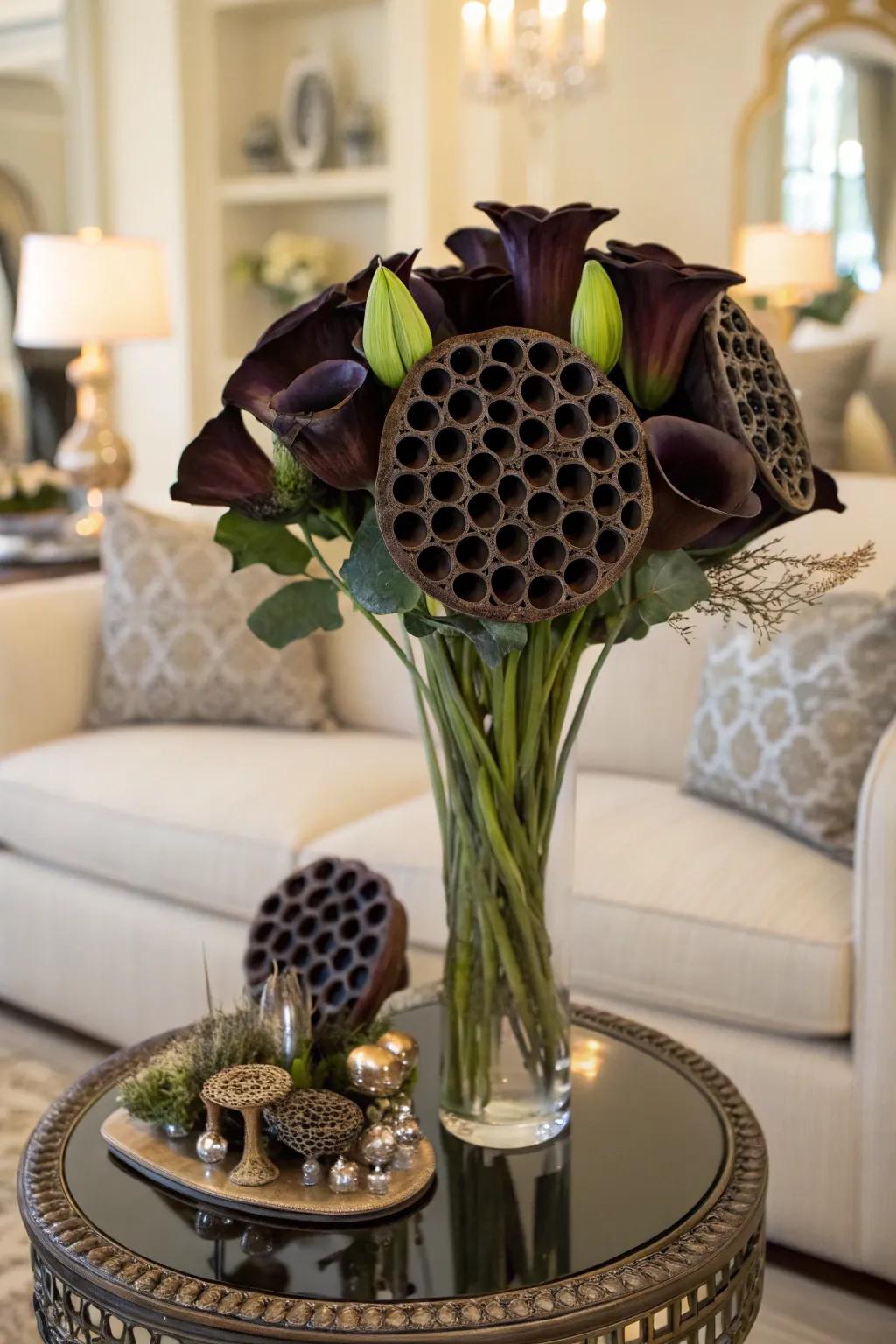Lily seed cases inject texture and intrigue into this somber Halloween bouquet.
