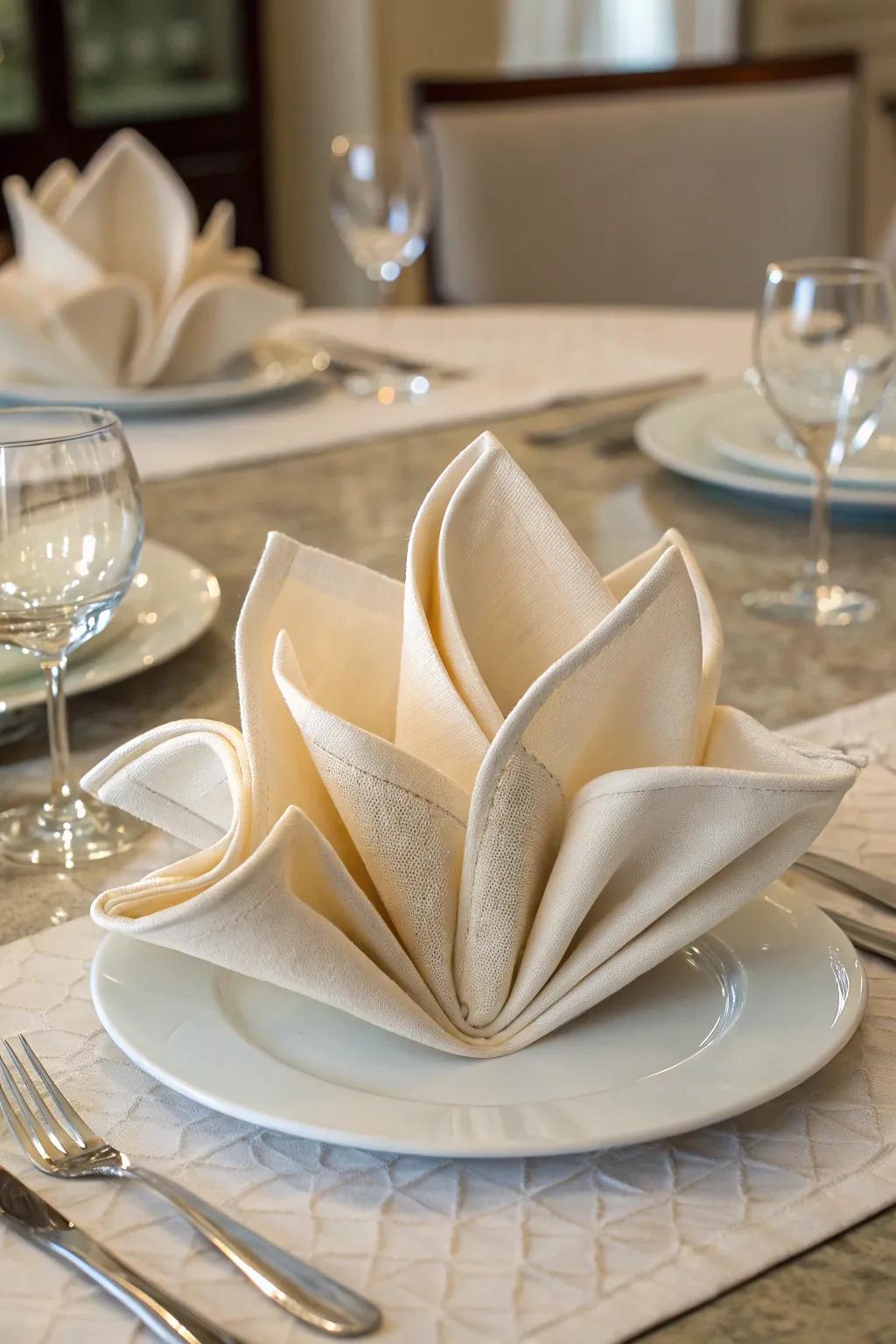 The courtyard flower napkin fold, simple grace at its best.