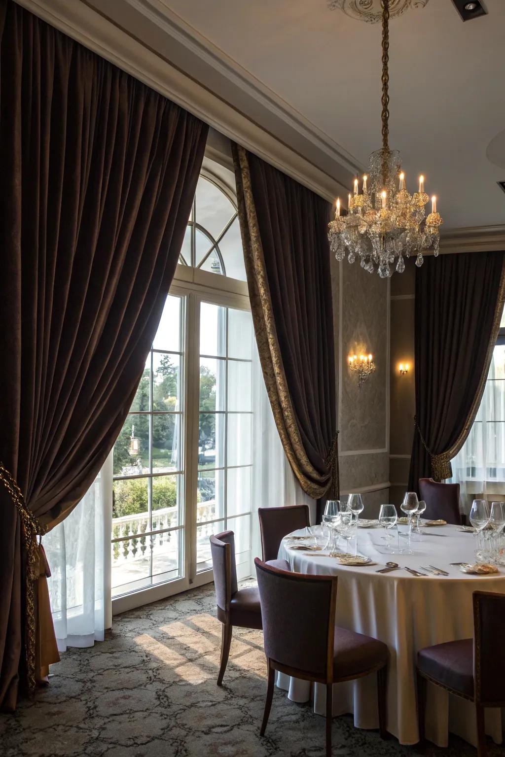 Floor-to-ceiling drapes create a dramatic flourish.