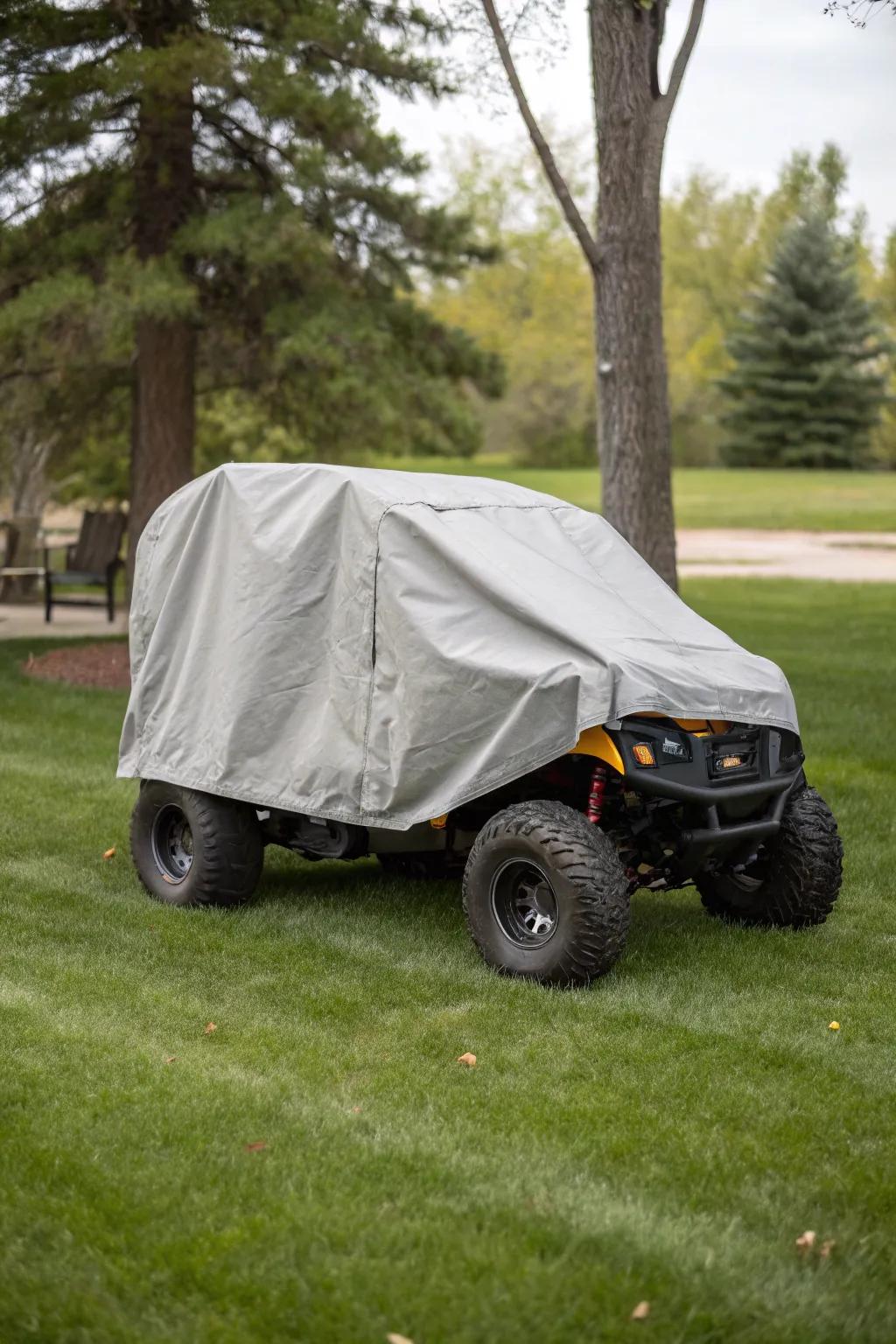 Custom covers protecting motorized toys stored outdoors.
