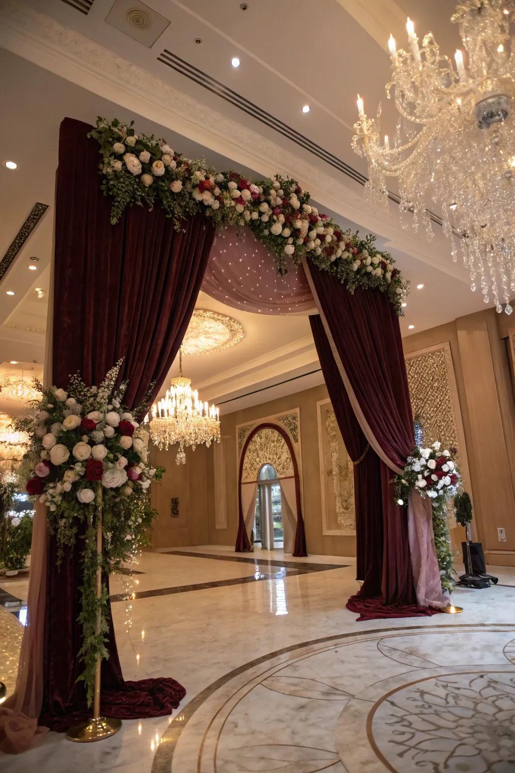 Sophisticated hangings contribute drama and refinement to a wedding arch.