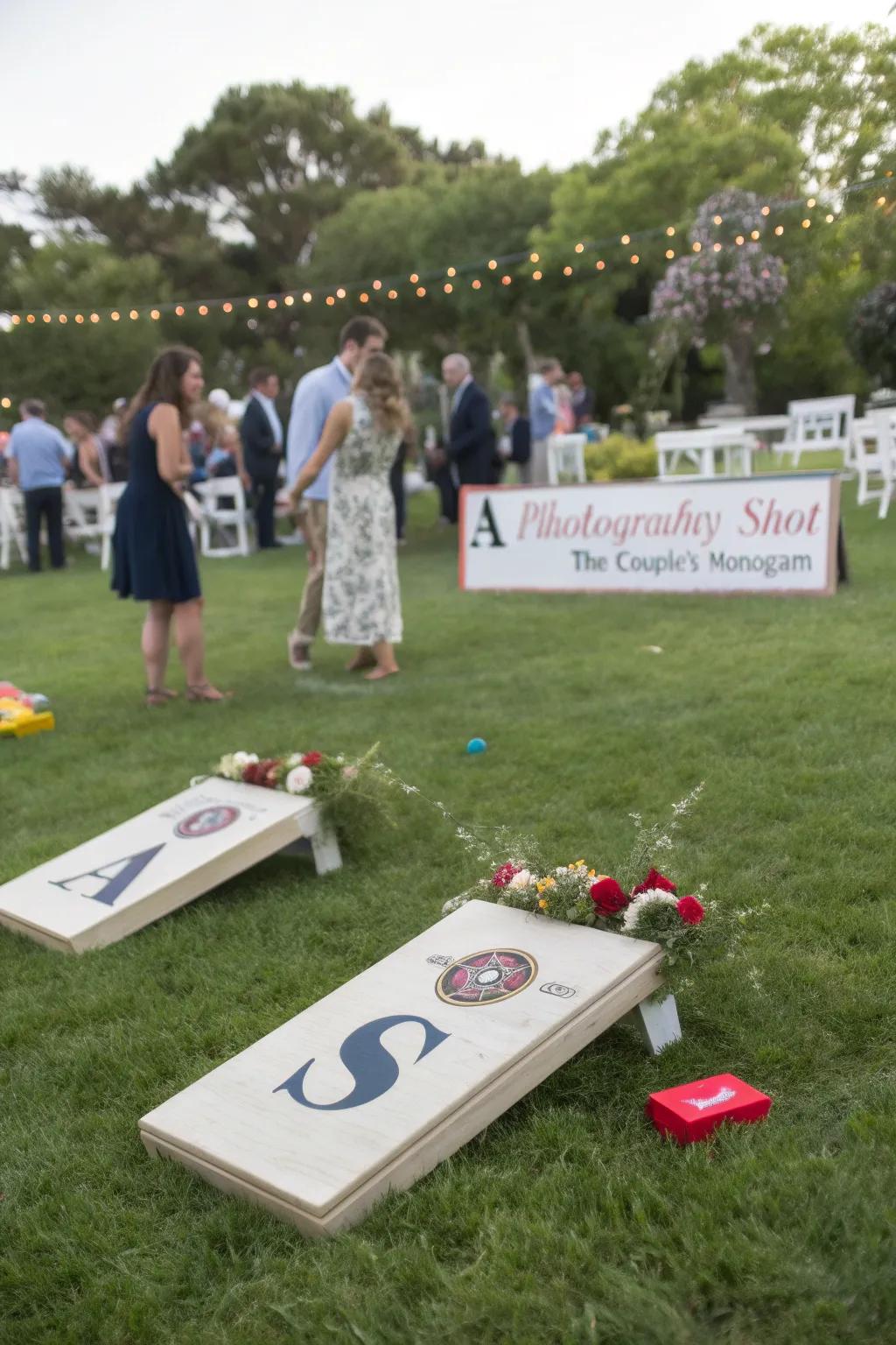 Individualized yard games at a wedding, presenting the couple's monogram and themed colors.