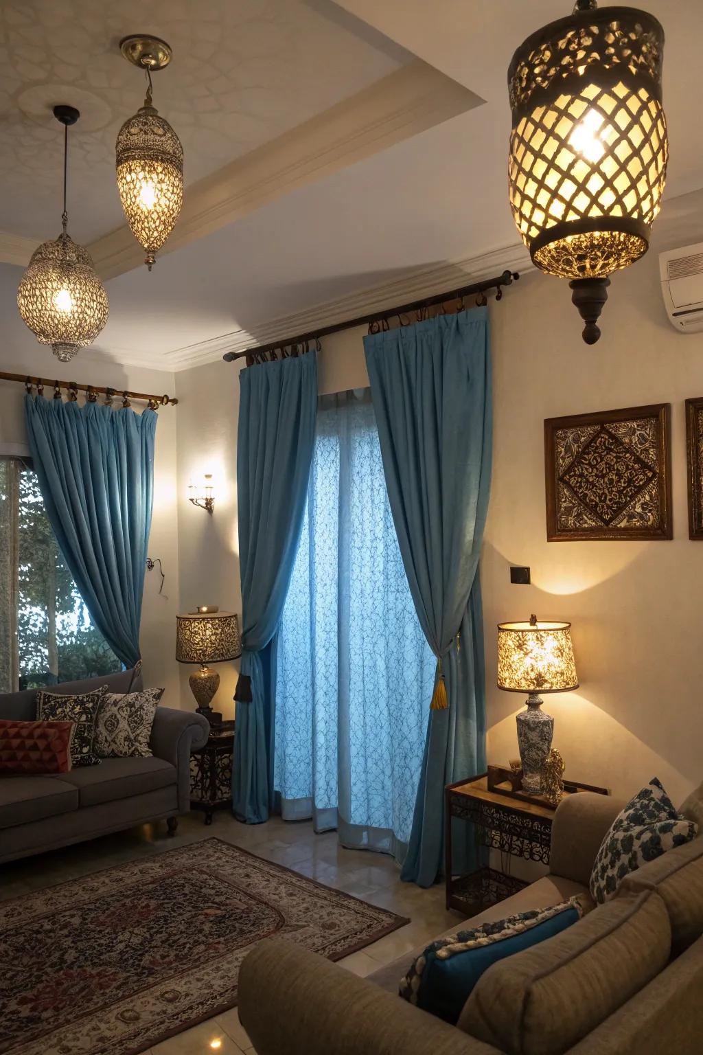 Different lighting fixtures interact with sky-hue drapes to alter the mood and elevate the area's ambiance.