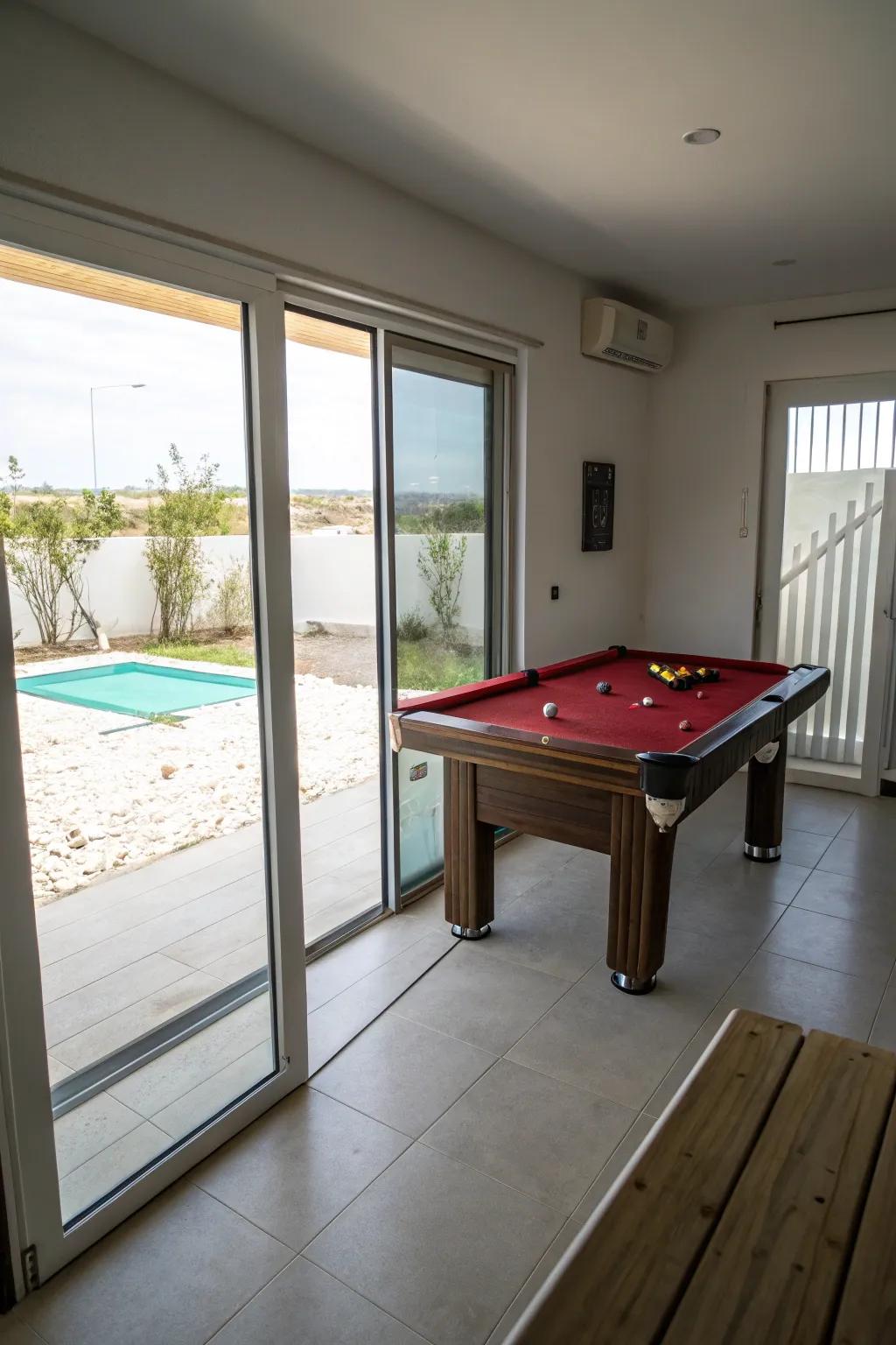 Pocket doors conserve space and enhance accessibility in a small pool room.