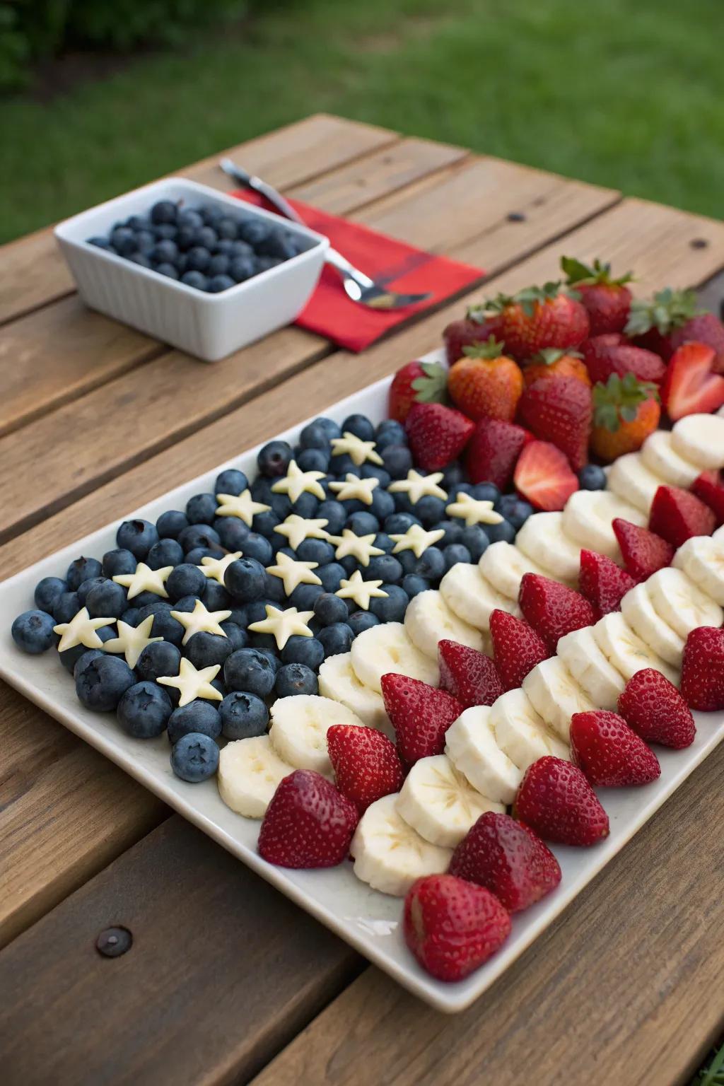 A fruit arrangement fashioned to resemble the Stars and Stripes, ideal for a Fourth of July picnic.