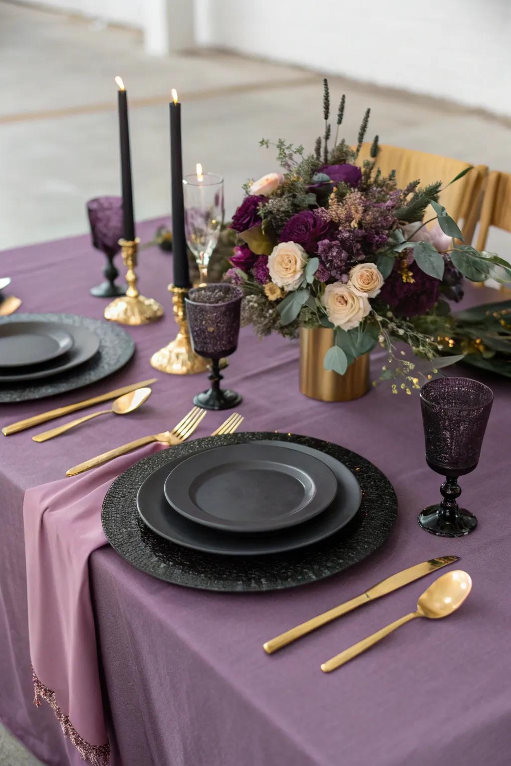A sophisticated table layout featuring purple linens and black dishware.