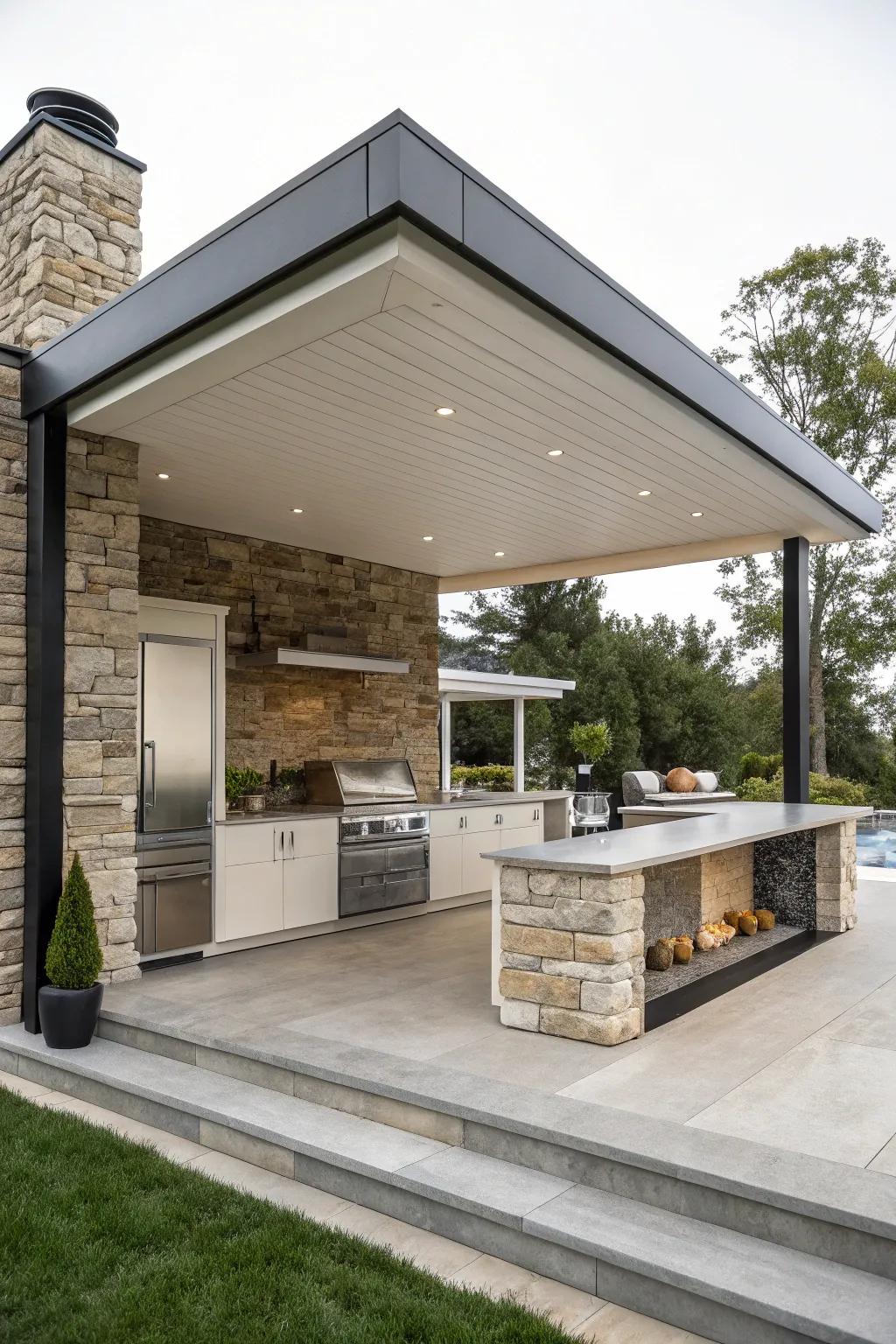 A fashionable pavilion accentuated with stone detailing for a modern outdoor kitchen.