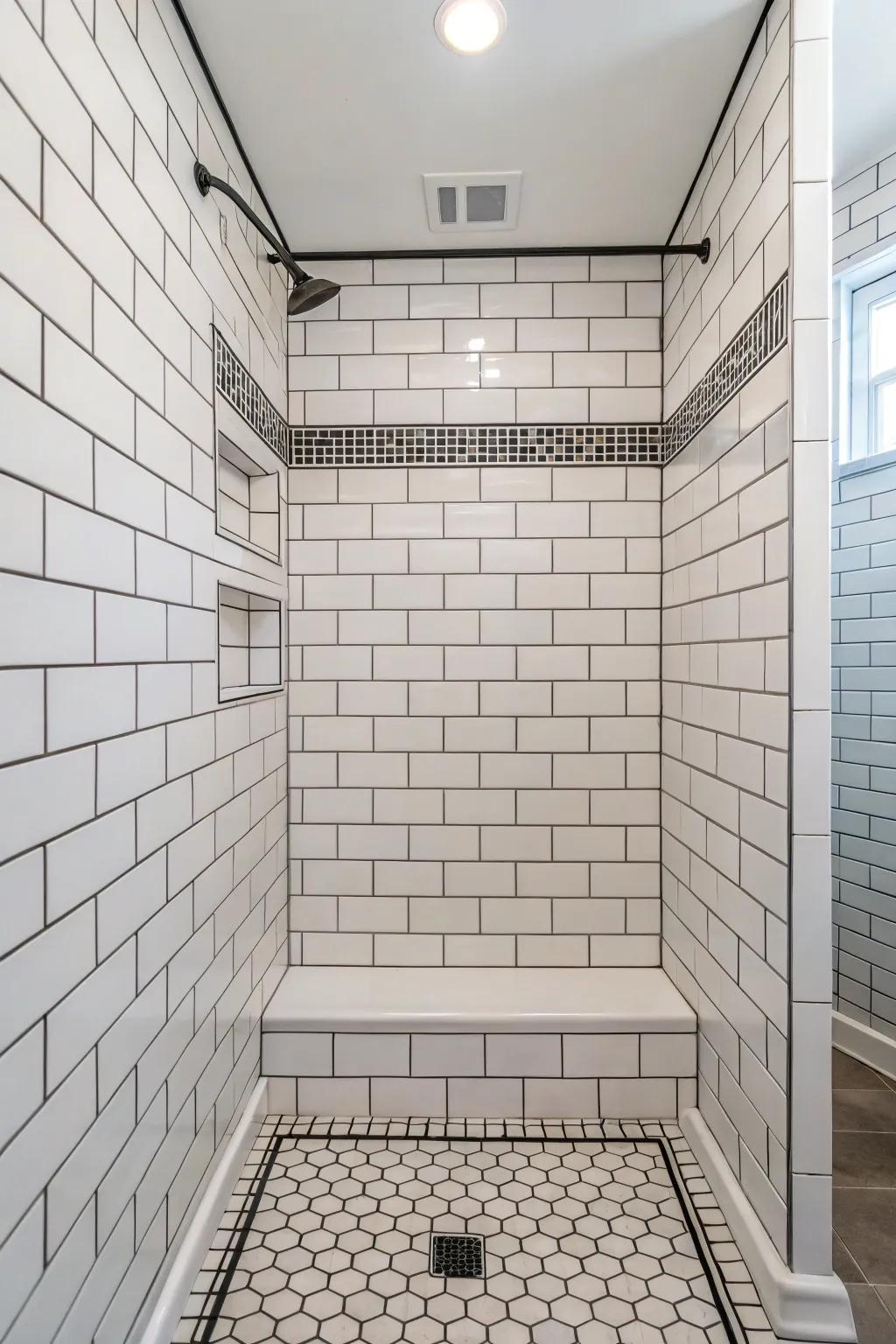 Traditional white brick-style tiles in a shower having contrasting lines of grout.