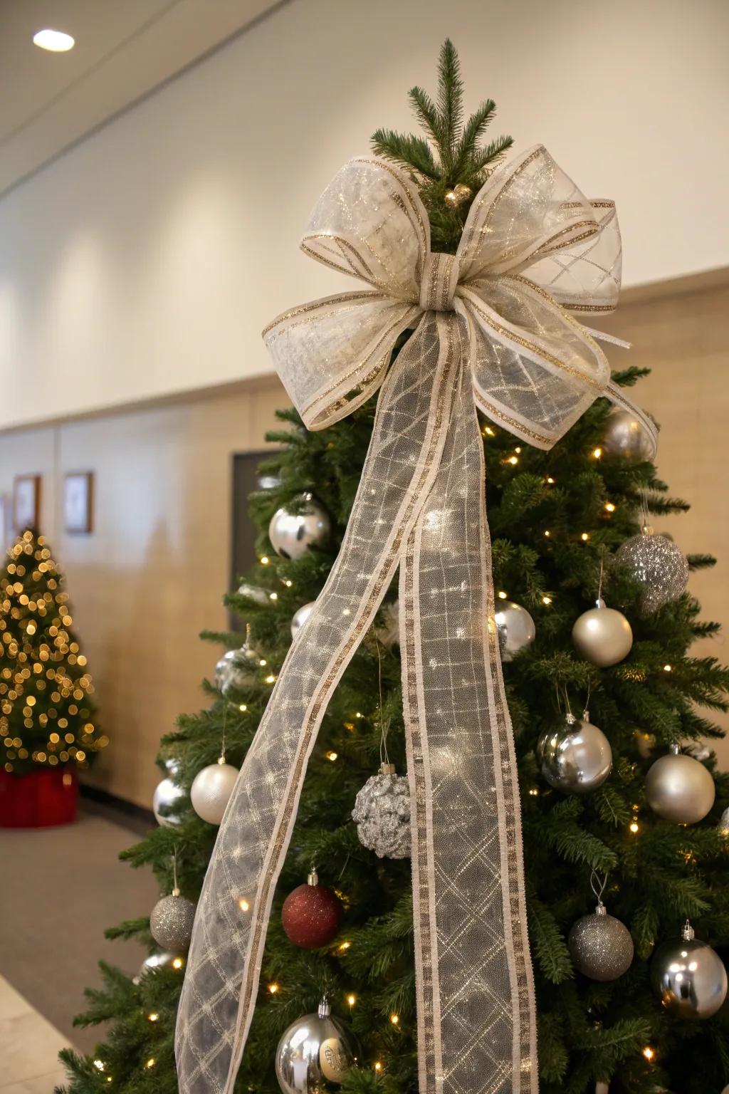 A Christmas tree topped with a grand bow, adding a classic touch to the festive decor.