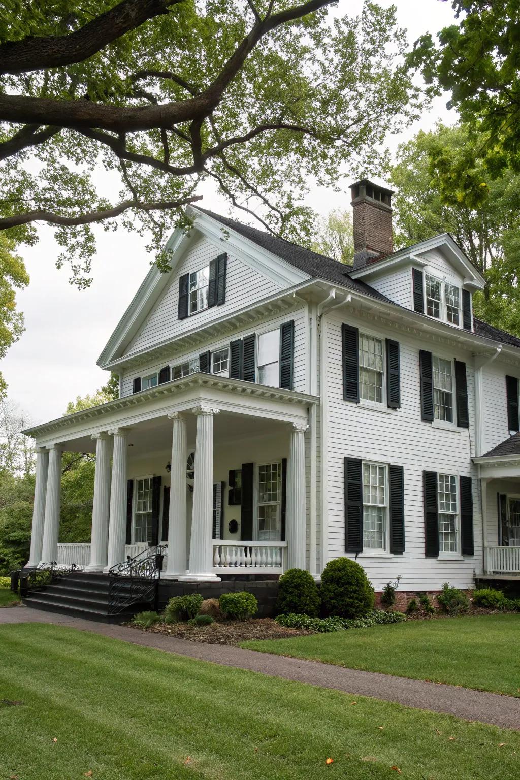 Colonial house featuring white siding and black accents.