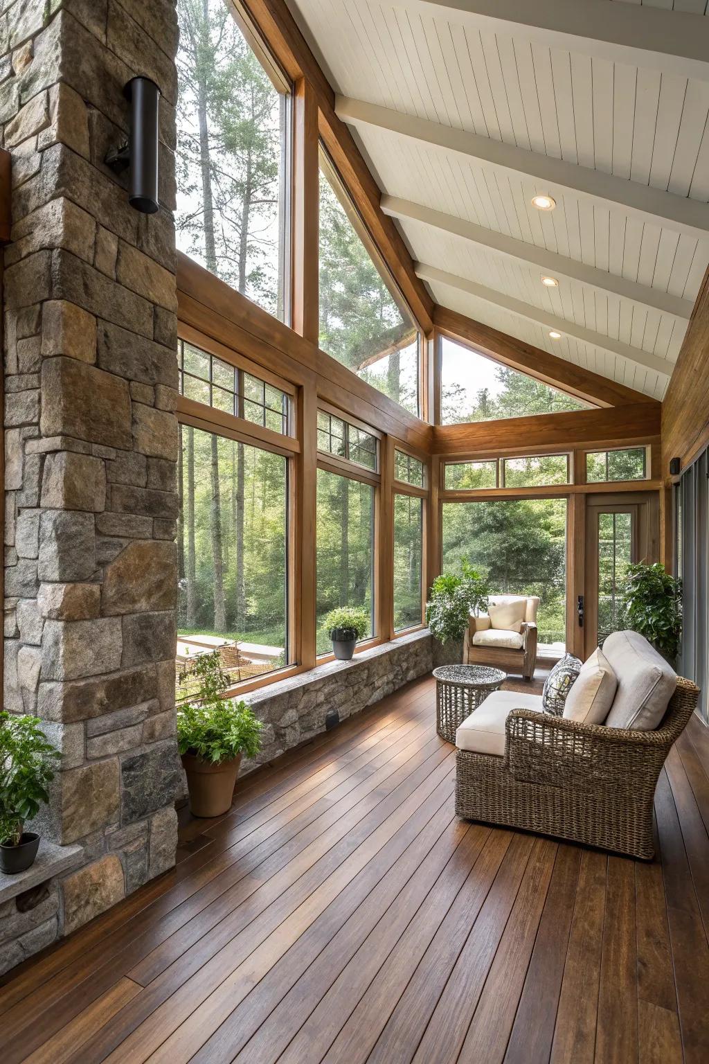 Natural wood and stone bring a rustic charm to a modern sunroom.
