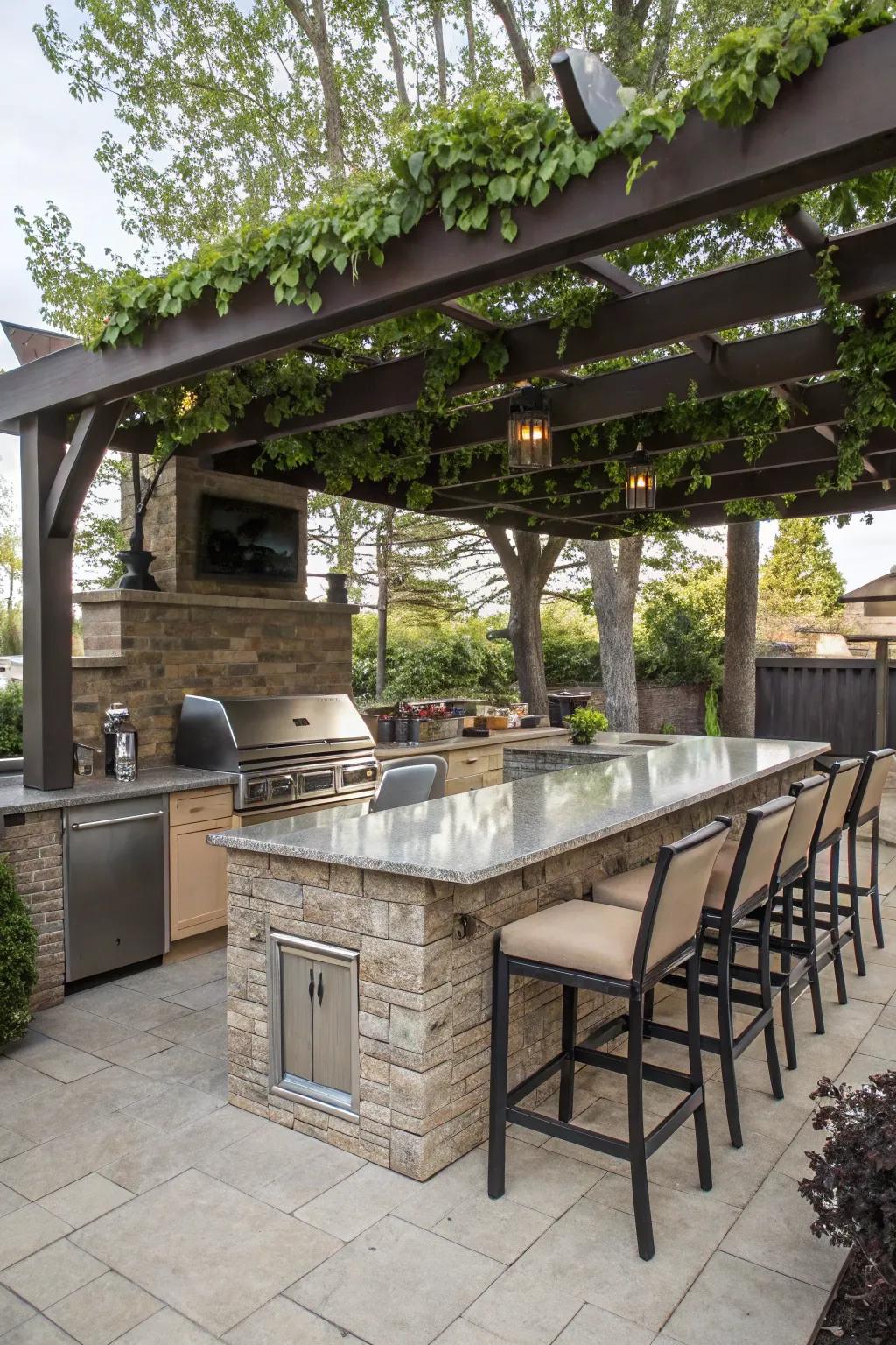 An inviting outdoor kitchen island with bar chairs and a seating area sheltered by a pergola.