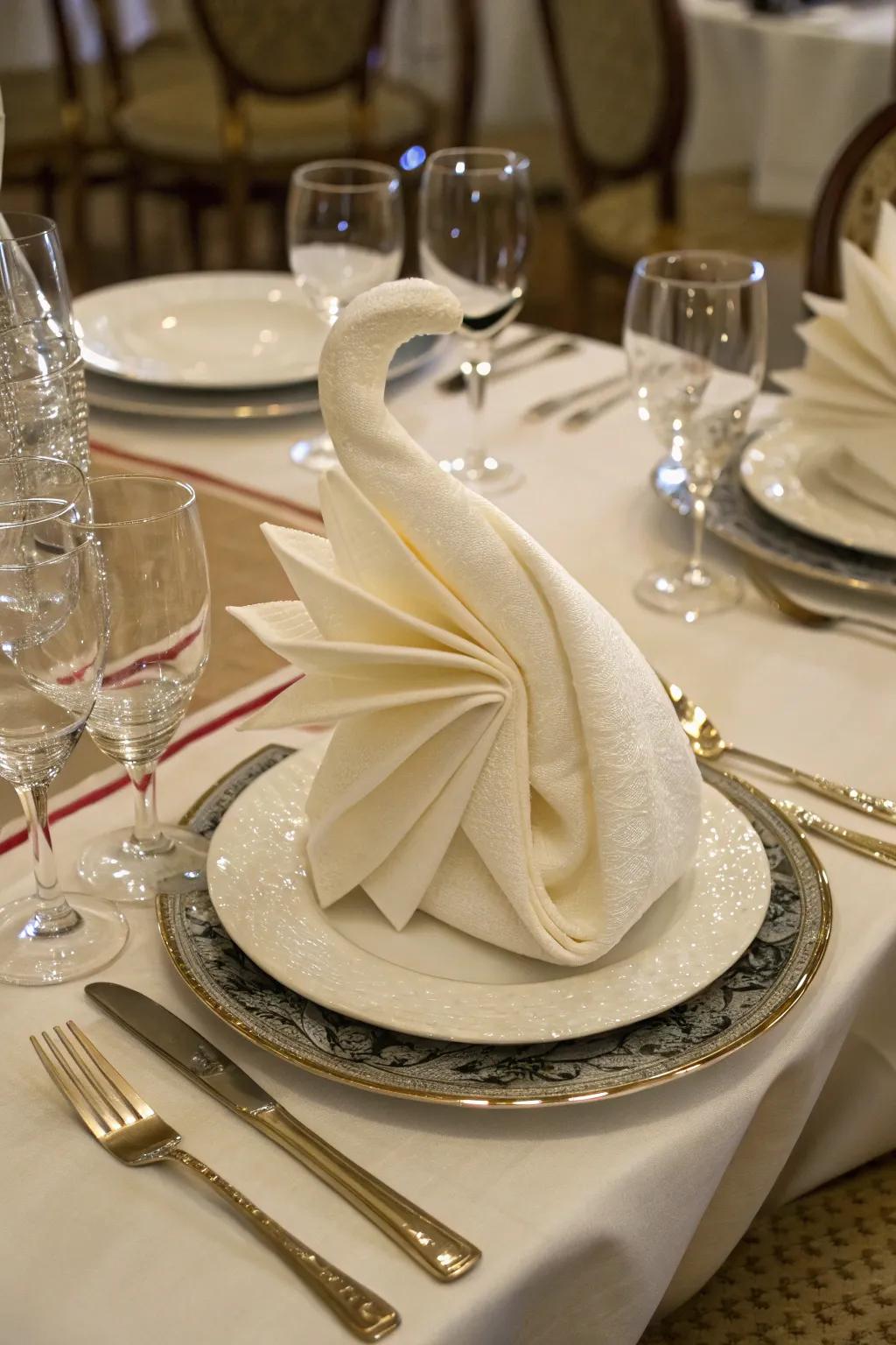 An avian napkin fold contributes a hint of class to any supper.