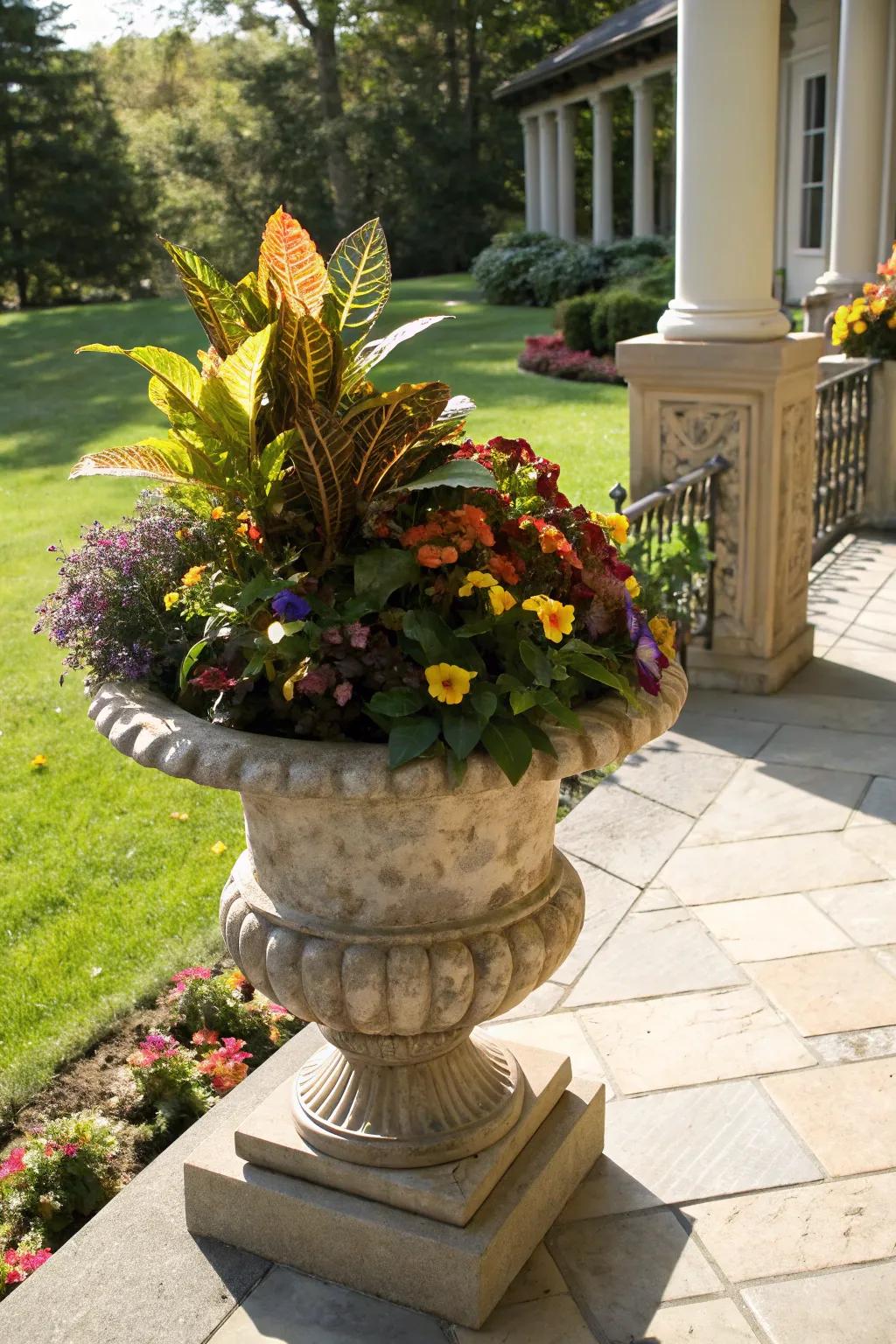Bold tones with radiant foliage and garden jewels in an autumn urn.