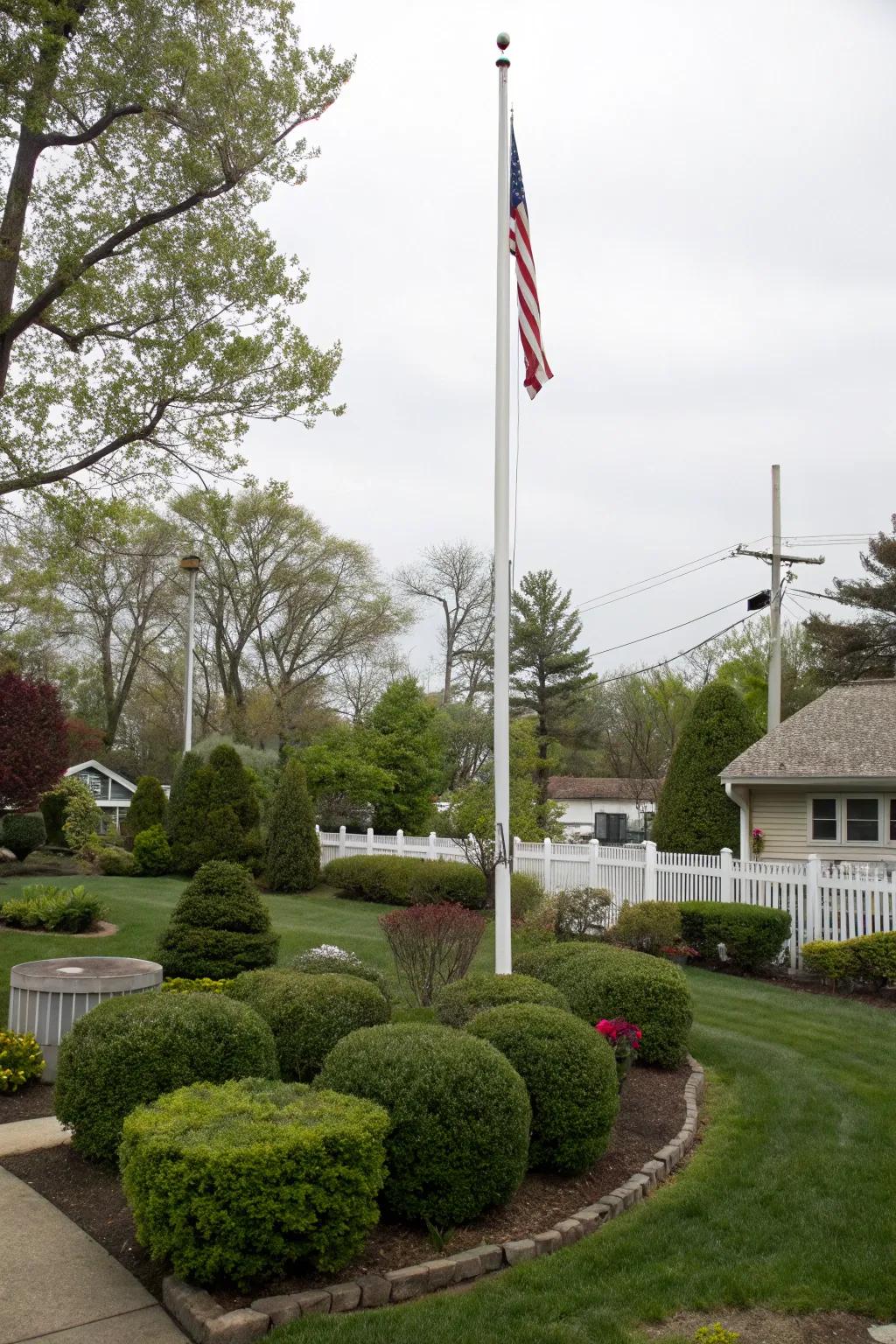 Bushes and hedges create a rich backdrop for any flagpole.