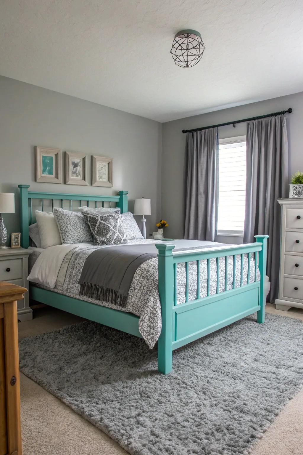 A turquoise bed frame establishes a stunning point of focus in a grey-themed space.