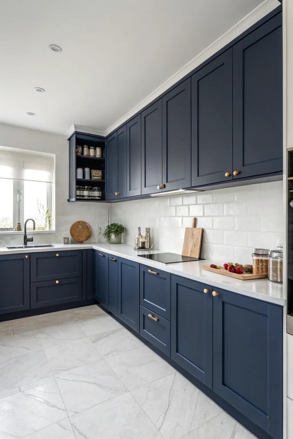 Understated marine blue cabinetry offers a refined and modern kitchen visage.