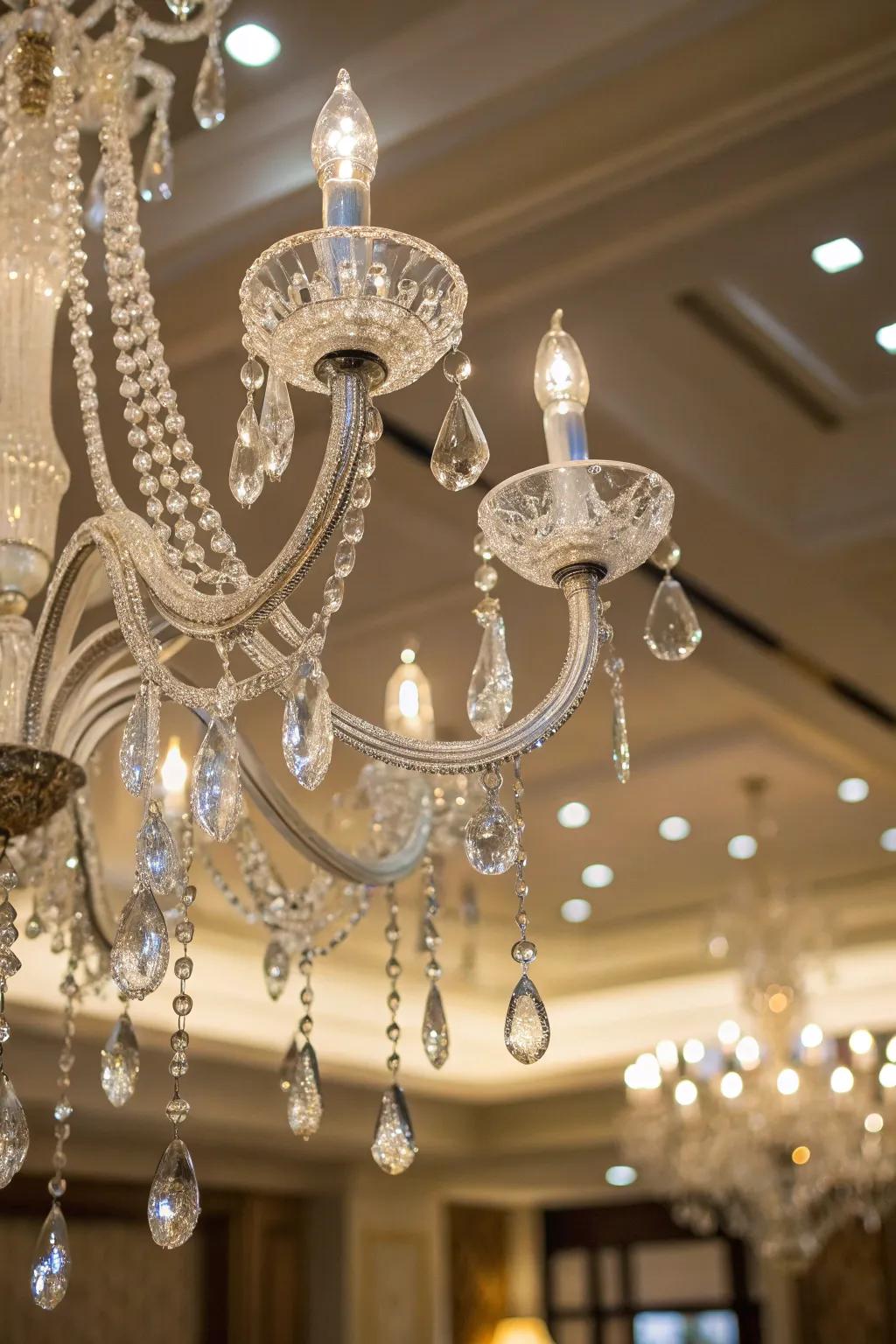 A chandelier lit up with sparkling ornaments.