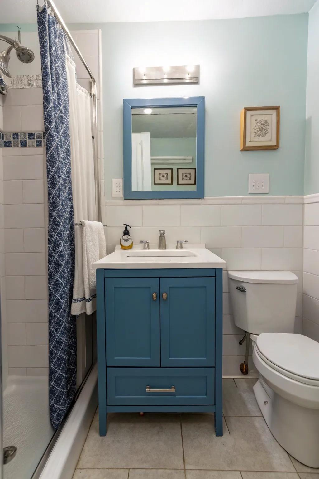 A modern blue vanity emerges as a centerpiece within this stylish bathroom.