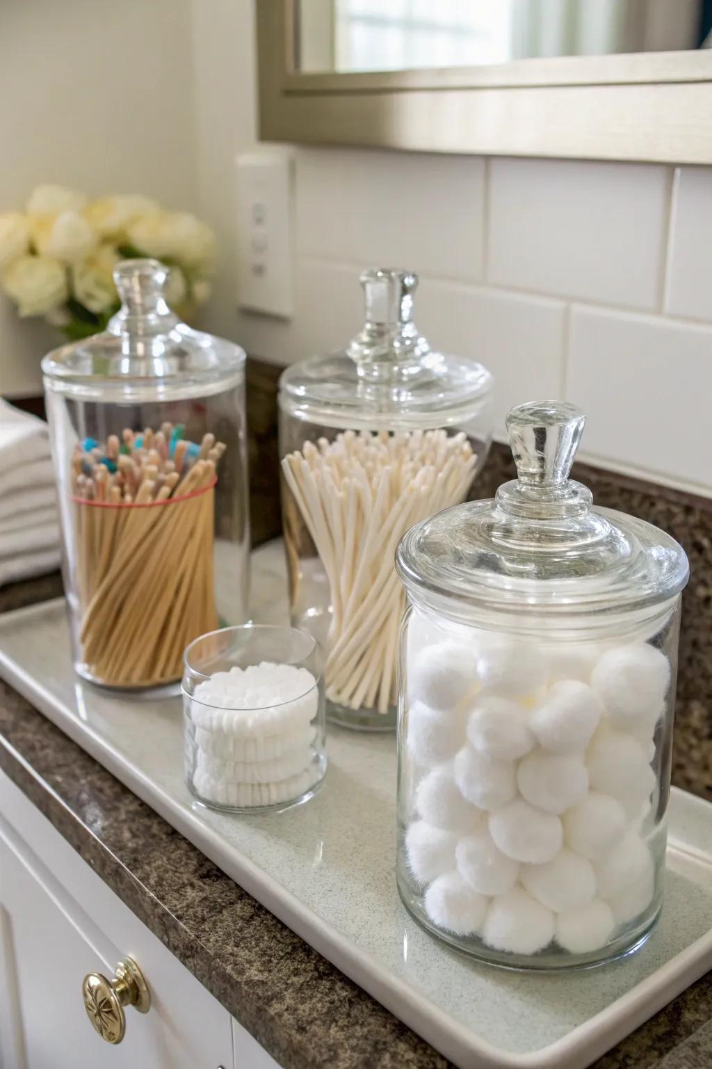 Keep your necessities well-organized and easily accessible with clear glass jars.