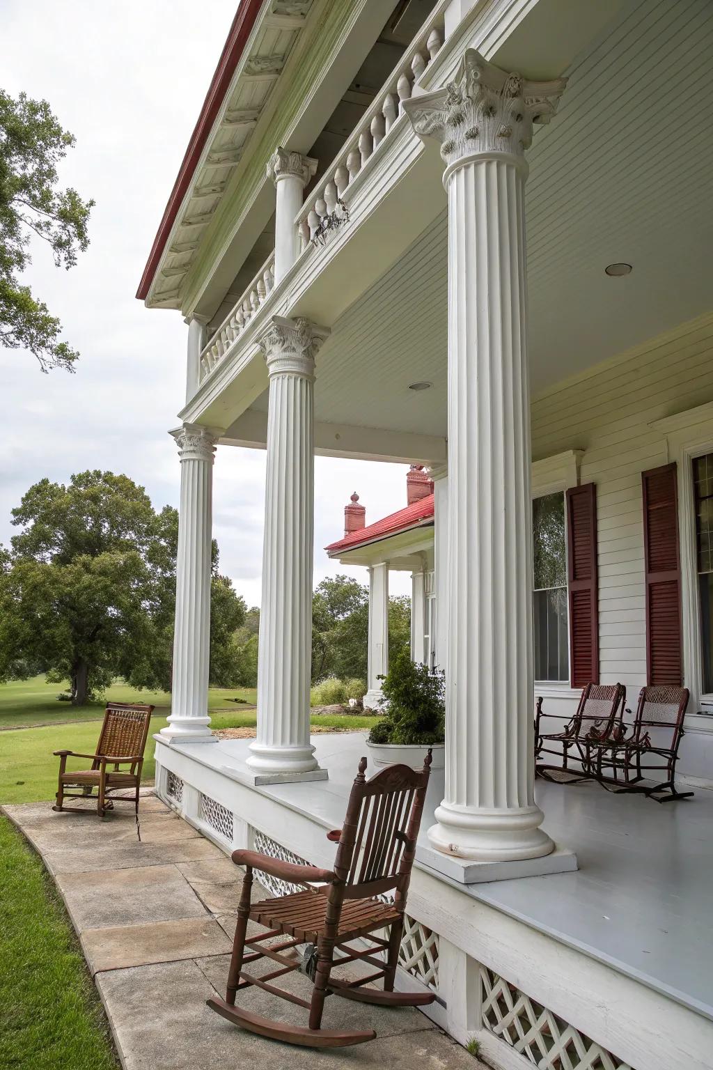 Colonial home featuring a majestic porch and pillars.