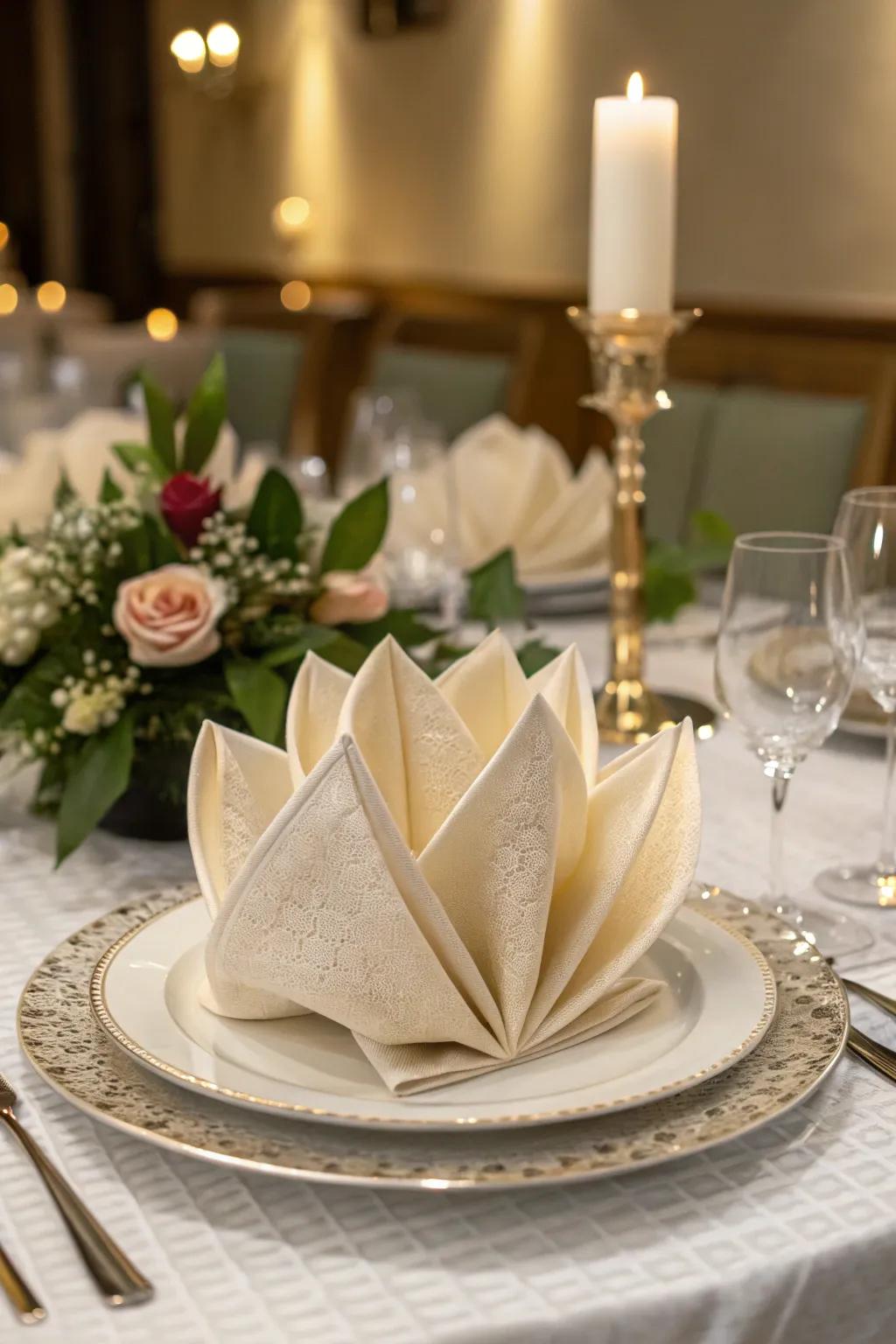 A cloth finely styled into a water lily bloom, injecting a natural style to the table.