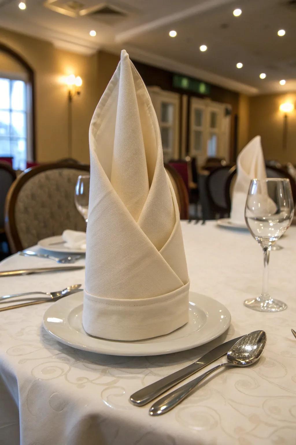 The cardinal crest napkin fold introduces a stylish touch.